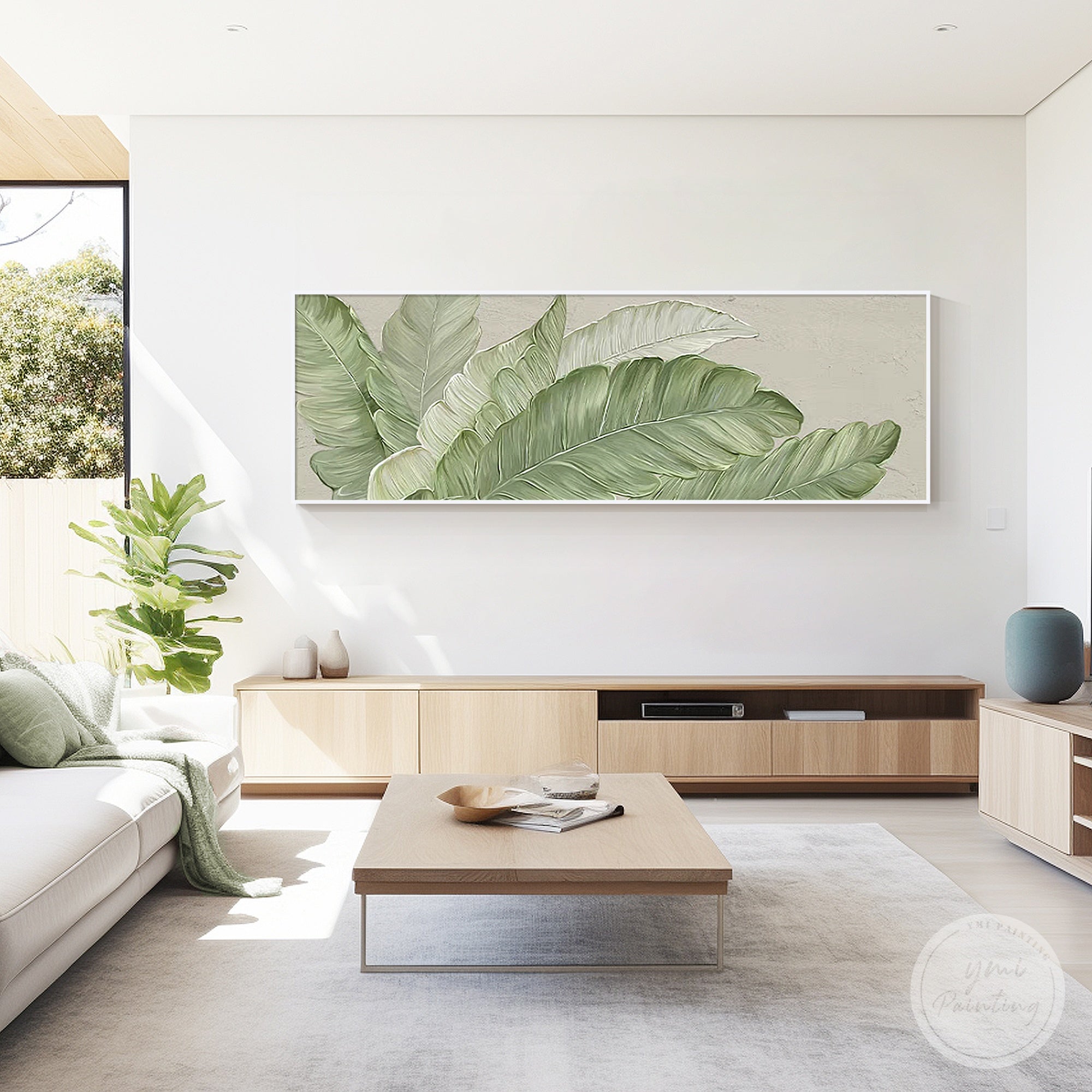 Canvas art enhancing a bright living room space with tropical leaves