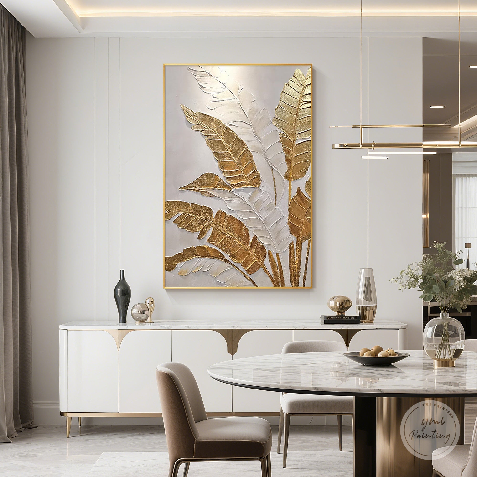 Gold and white tropical leaf wall art enhancing a modern dining room interior