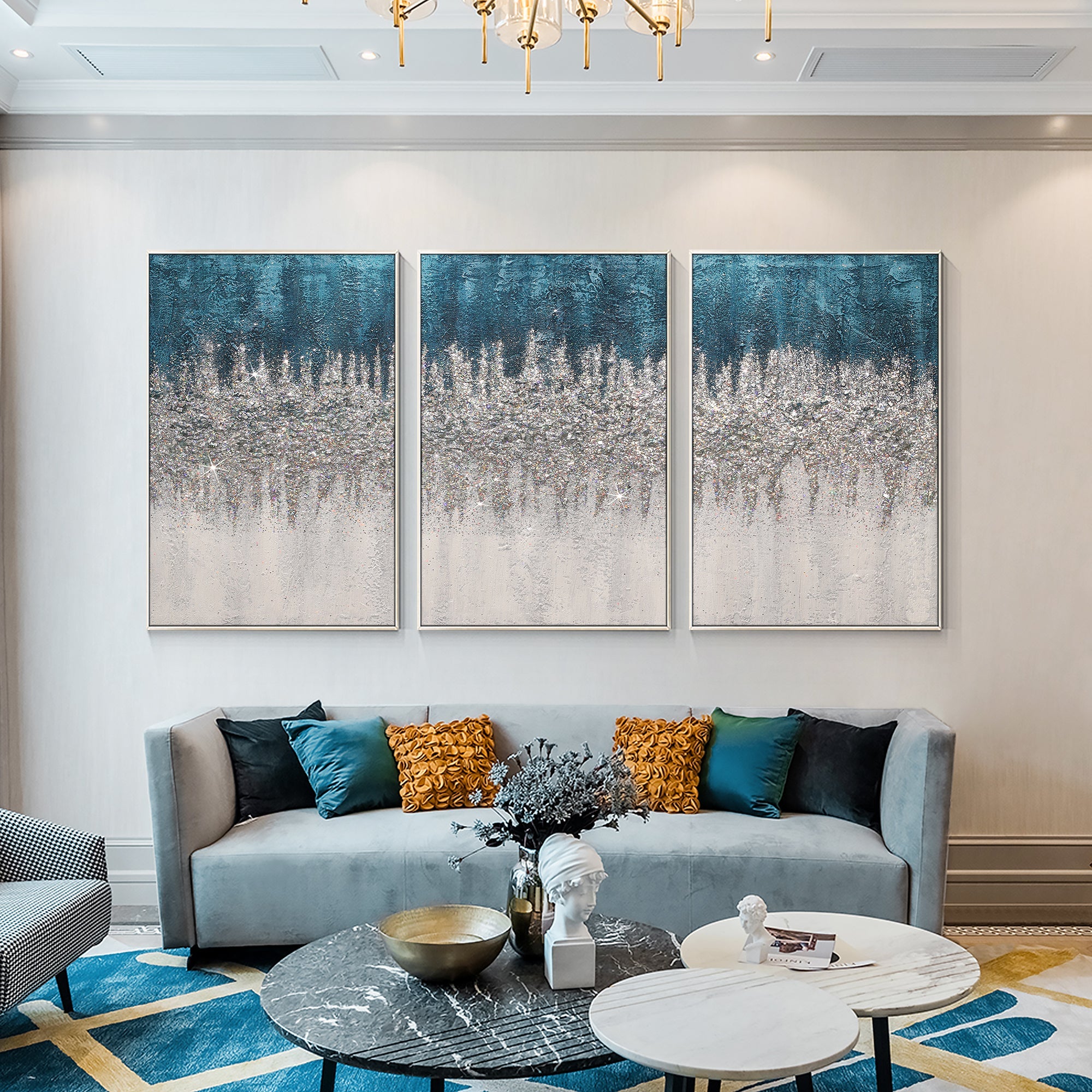 Turquoise abstract textured wall art styled with a blue-gray sofa in a contemporary living room