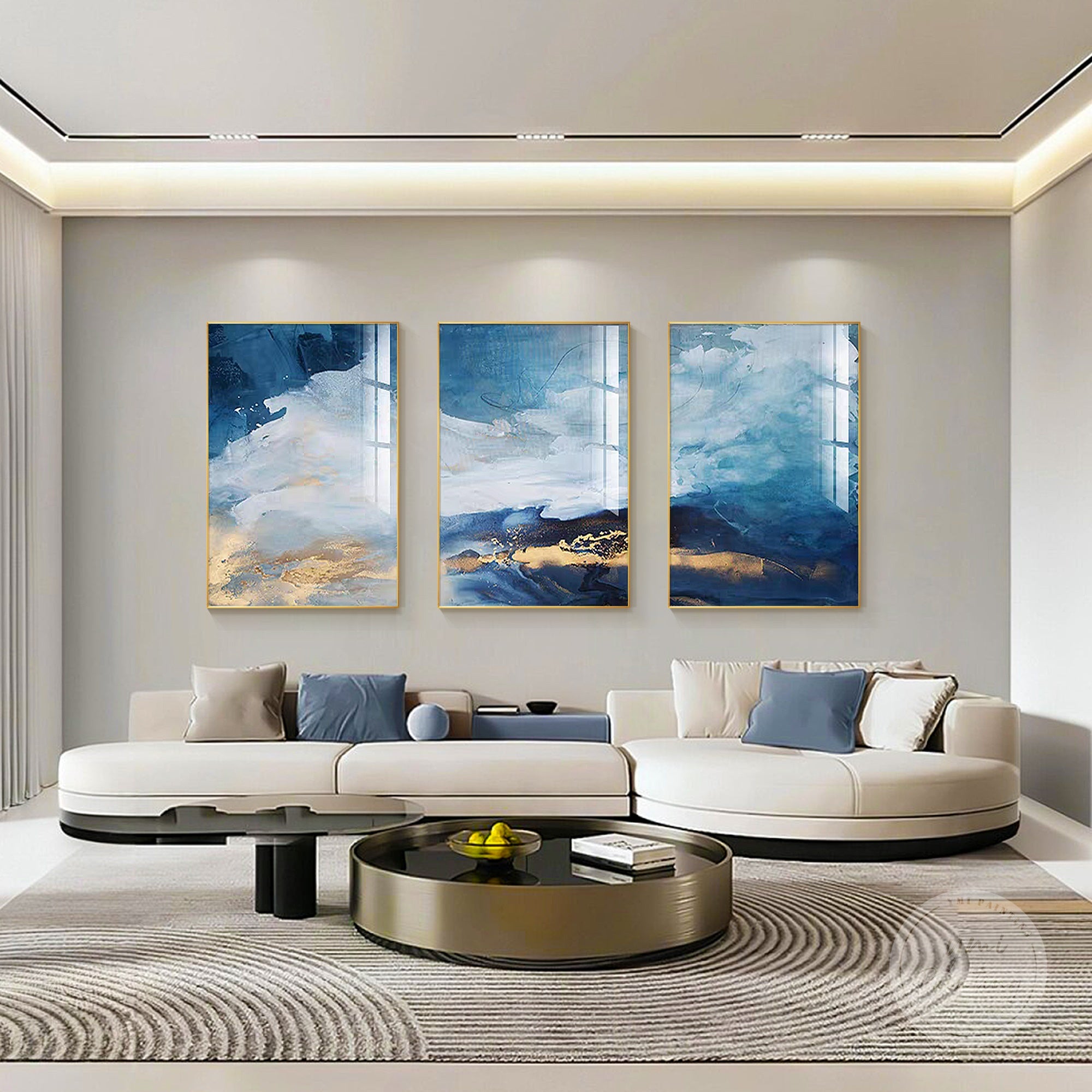 Contemporary abstract canvas paintings with rich teal, blue, and white hues.
