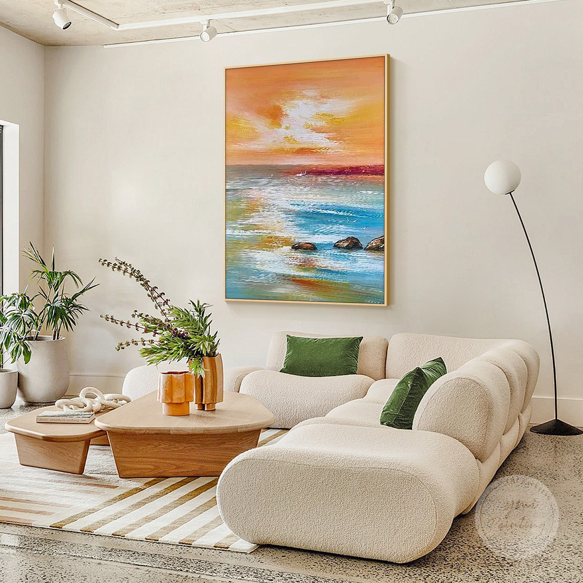 coastal sunset painting with orange sky reflected on calm blue water