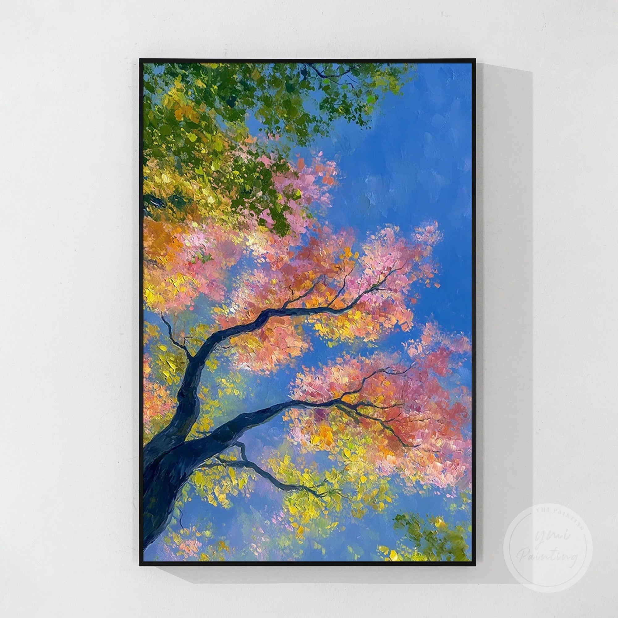 Vertical nature wall art with vibrant leaves against clear blue sky