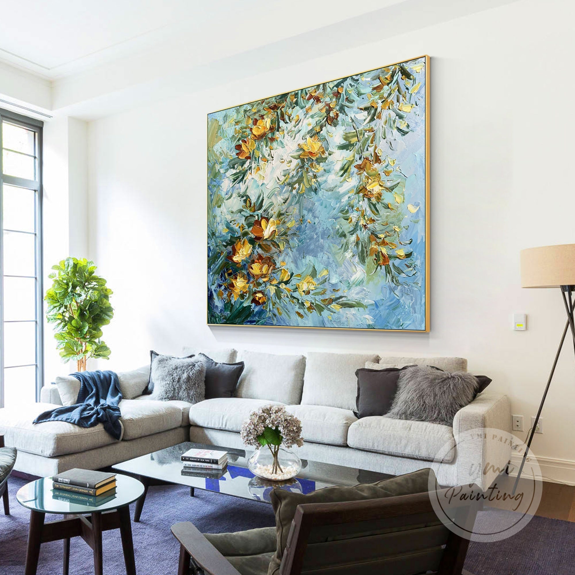 This golden floral artwork combines textured brushstrokes, vibrant greenery, and a serene blue background, making it a stunning addition to warm, modern interiors.