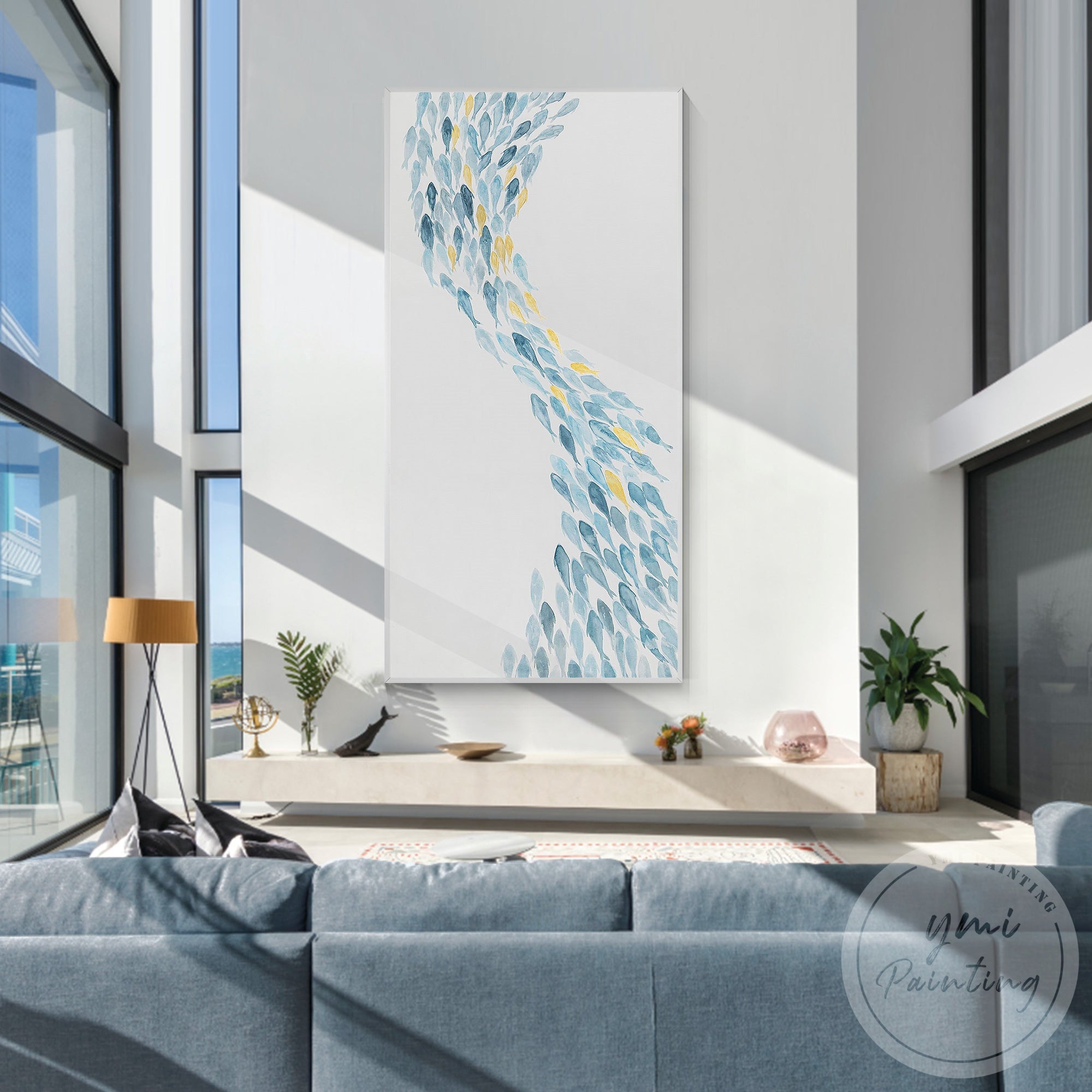 Handmade school of fish artwork in soft blue tones