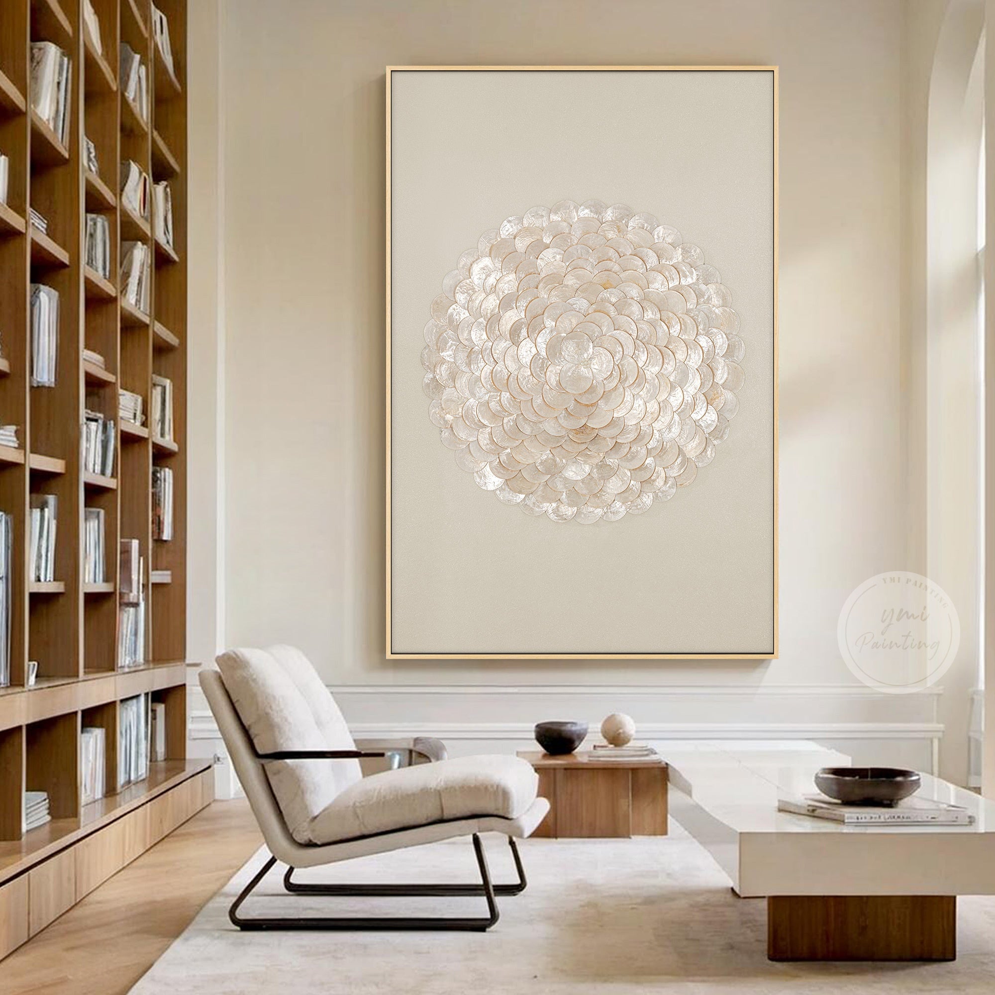 Neutral 3D capiz shell wall art above living room seating.