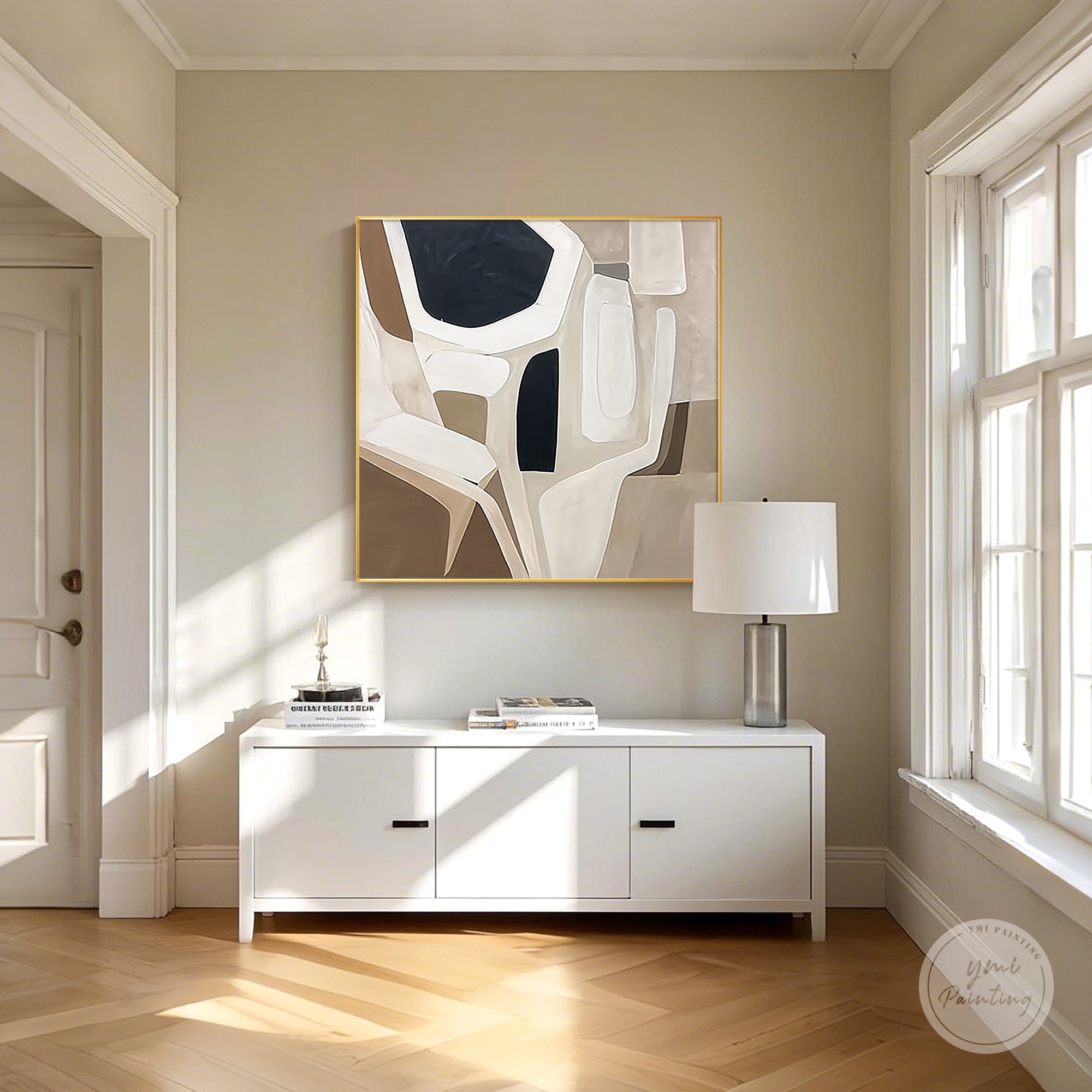 Minimalist geometric abstract canvas art above modern neutral living room sofa