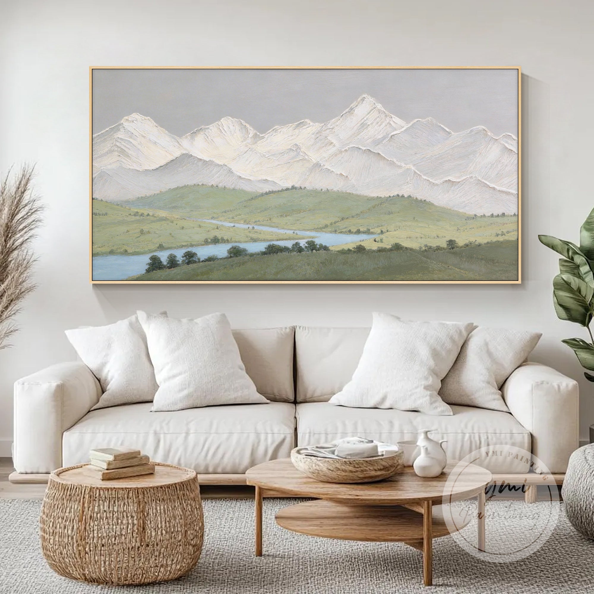 textured mountain canvas painting in bright minimalist living room