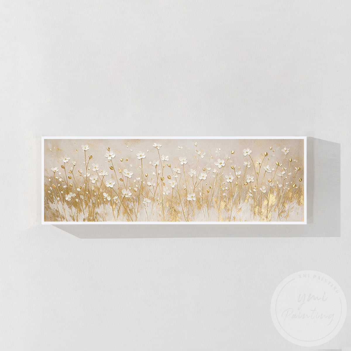 Elegant white and gold wall art displayed above a living room sofa