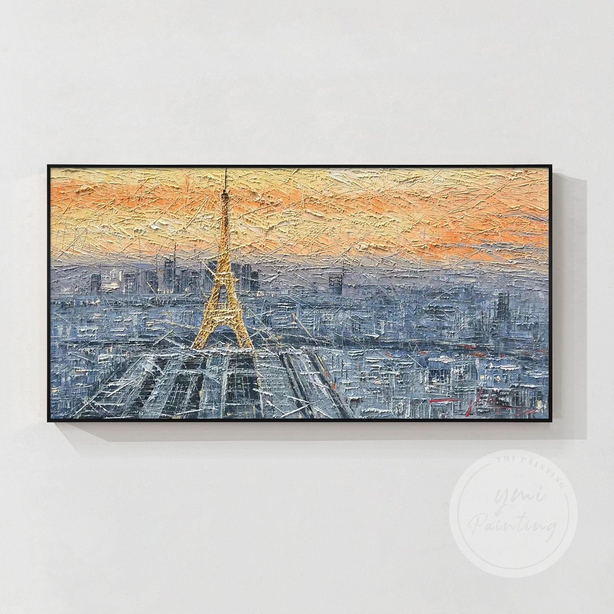Large framed Paris painting, showcasing the Eiffel Tower and skyline during the soft glow of sunrise, adding an elegant touch to any wall.