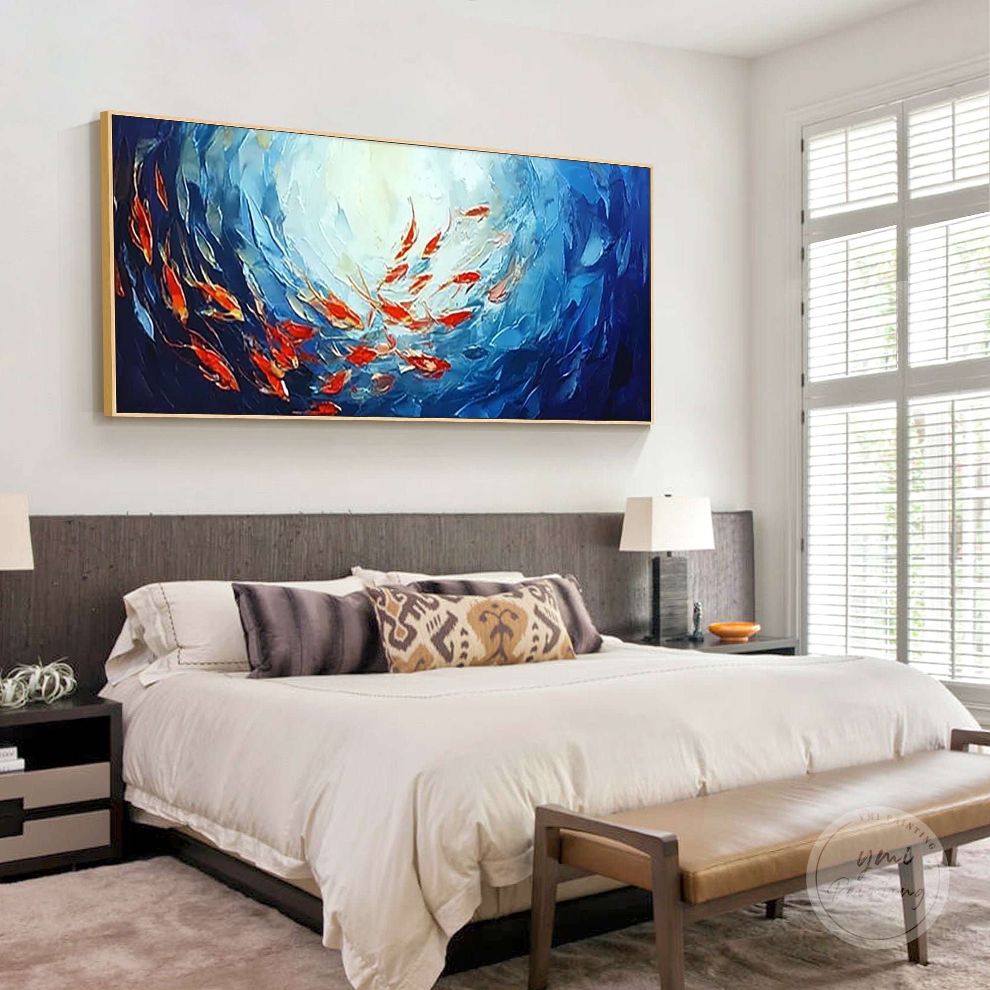 Handcrafted fish wall art depicting a vibrant school of red fish in the navy blue ocean.