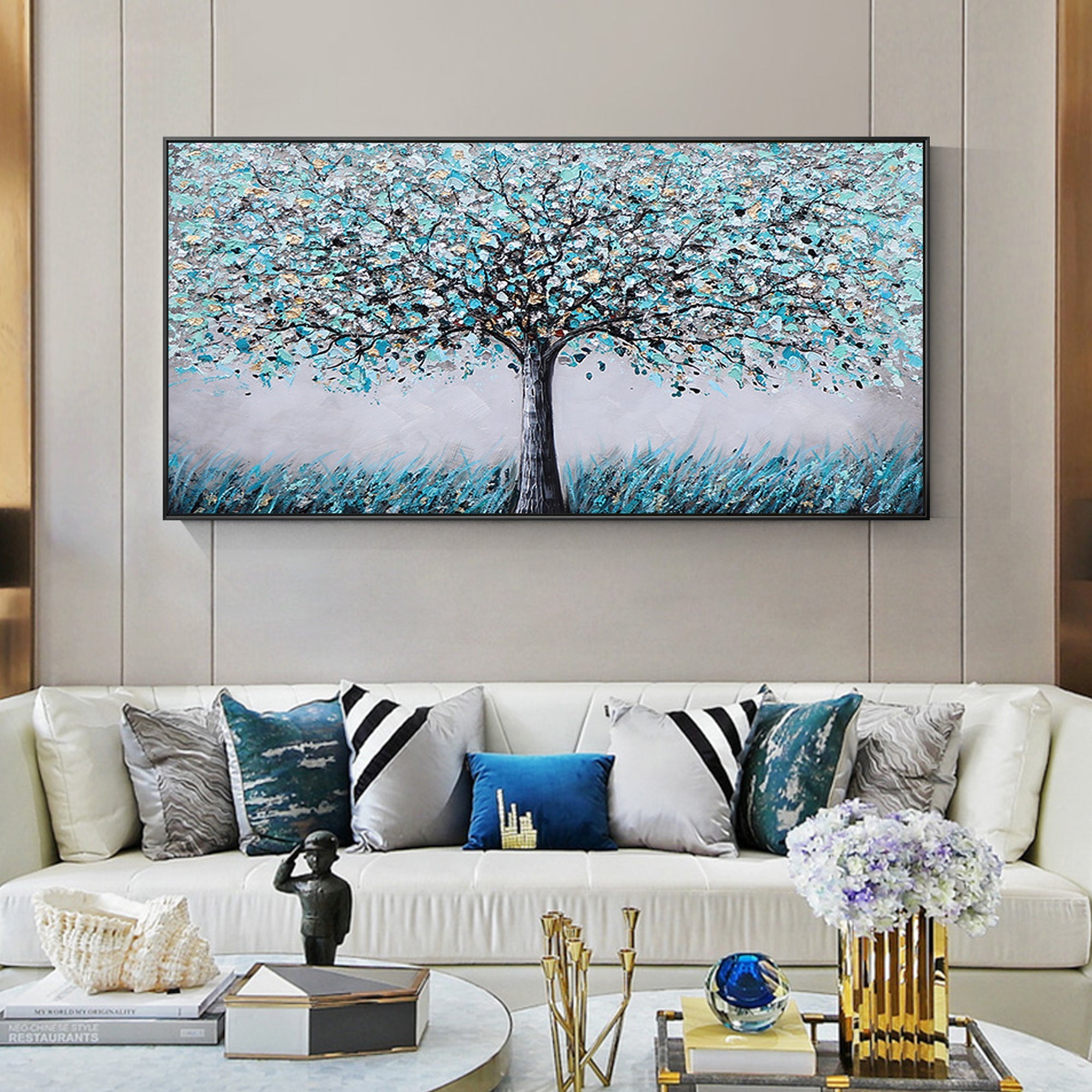 Abstract blue and gold blooming tree wall art displayed in a modern living room
