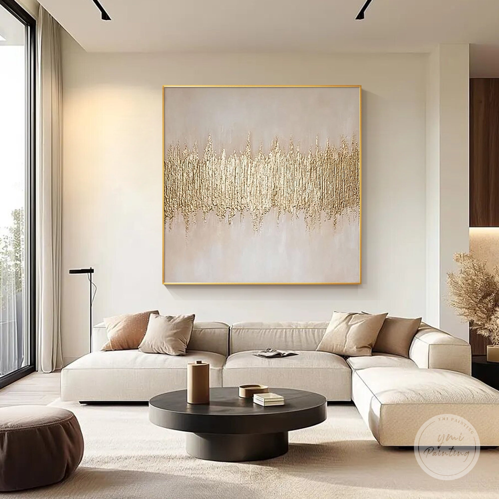 Abstract gold wall art with layered texture and soft neutral tones presented in a living room interior.
