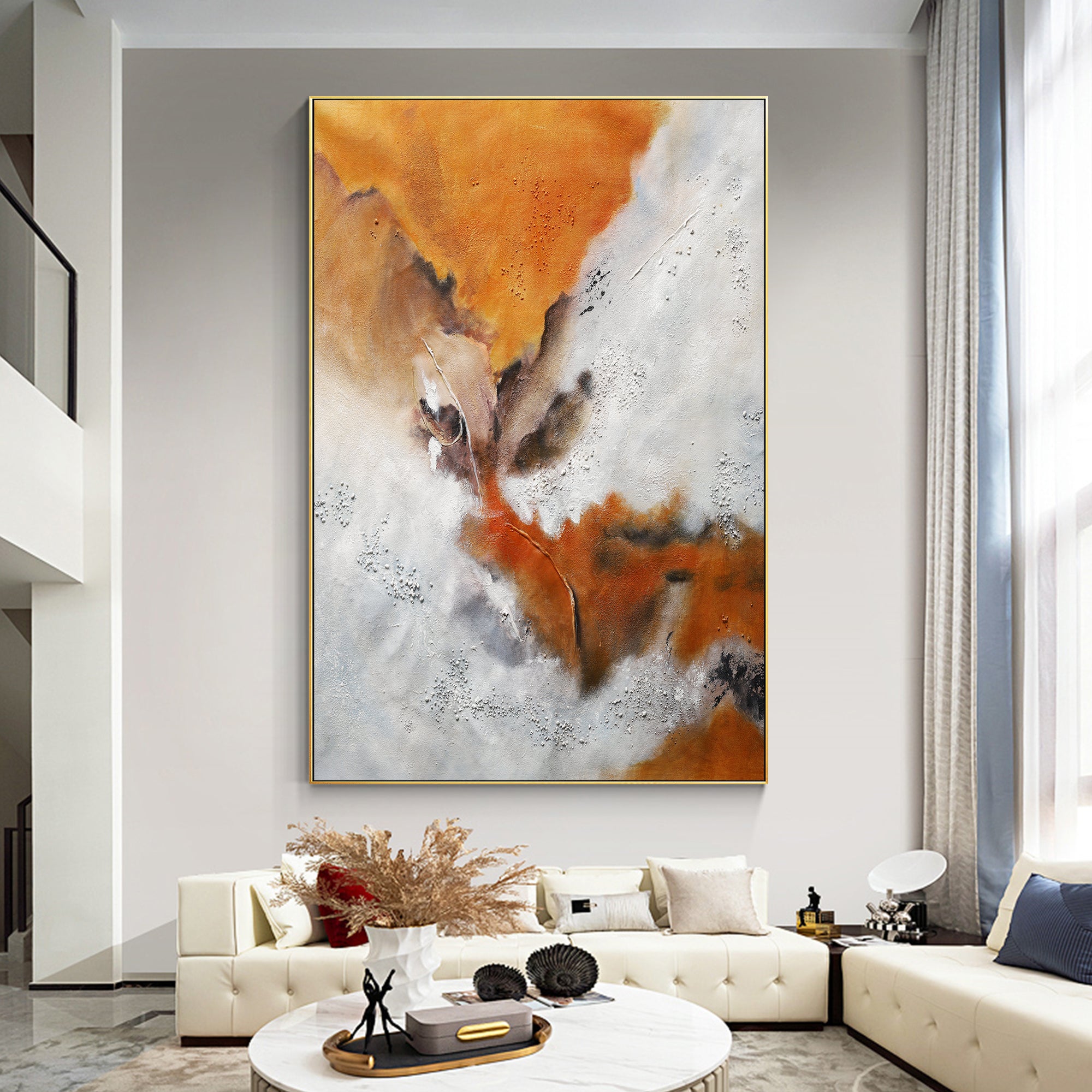 Abstract orange white brown canvas wall art above a sofa in the living room