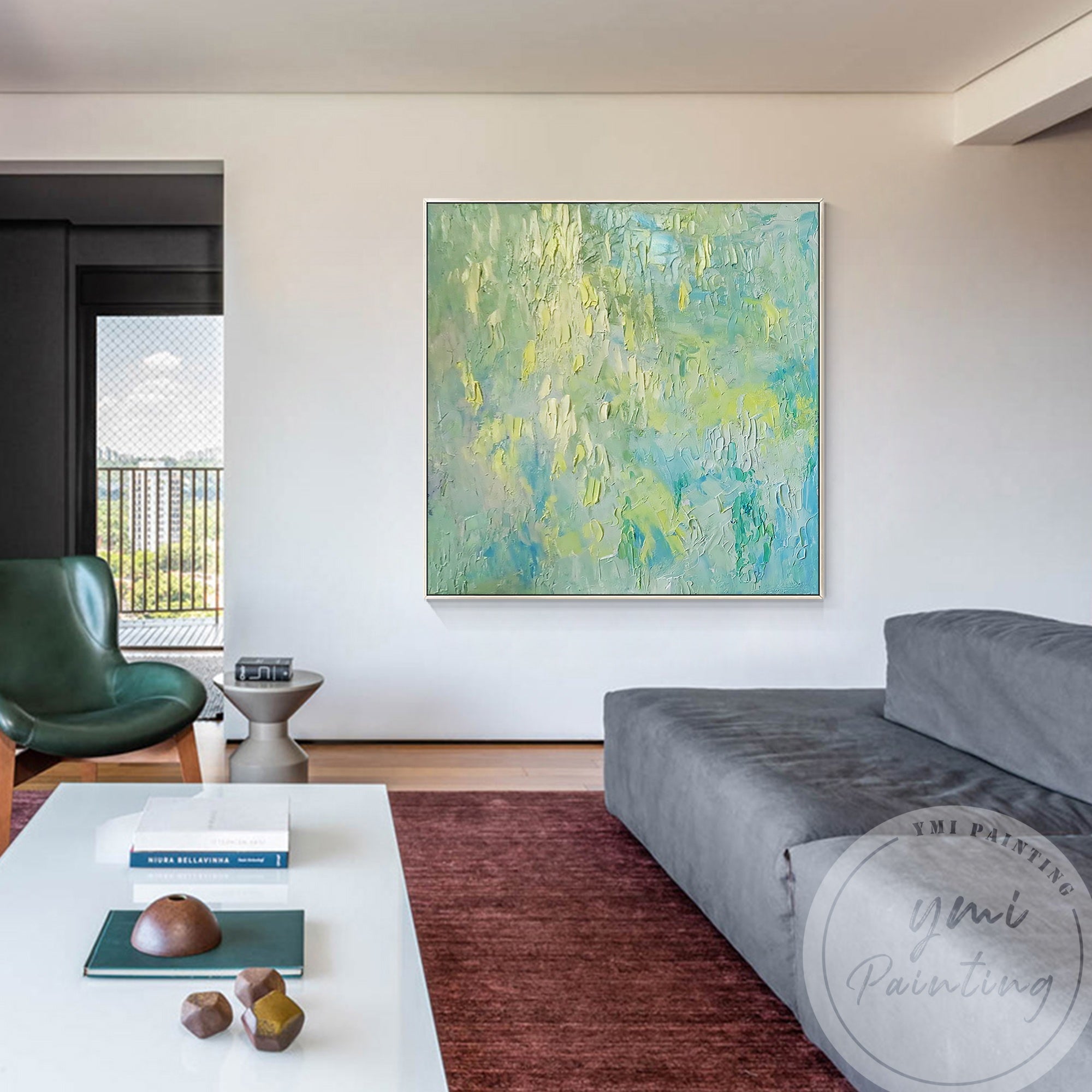 A serene abstract painting featuring green, blue, and pale yellow tones, adding elegance to a contemporary living room.