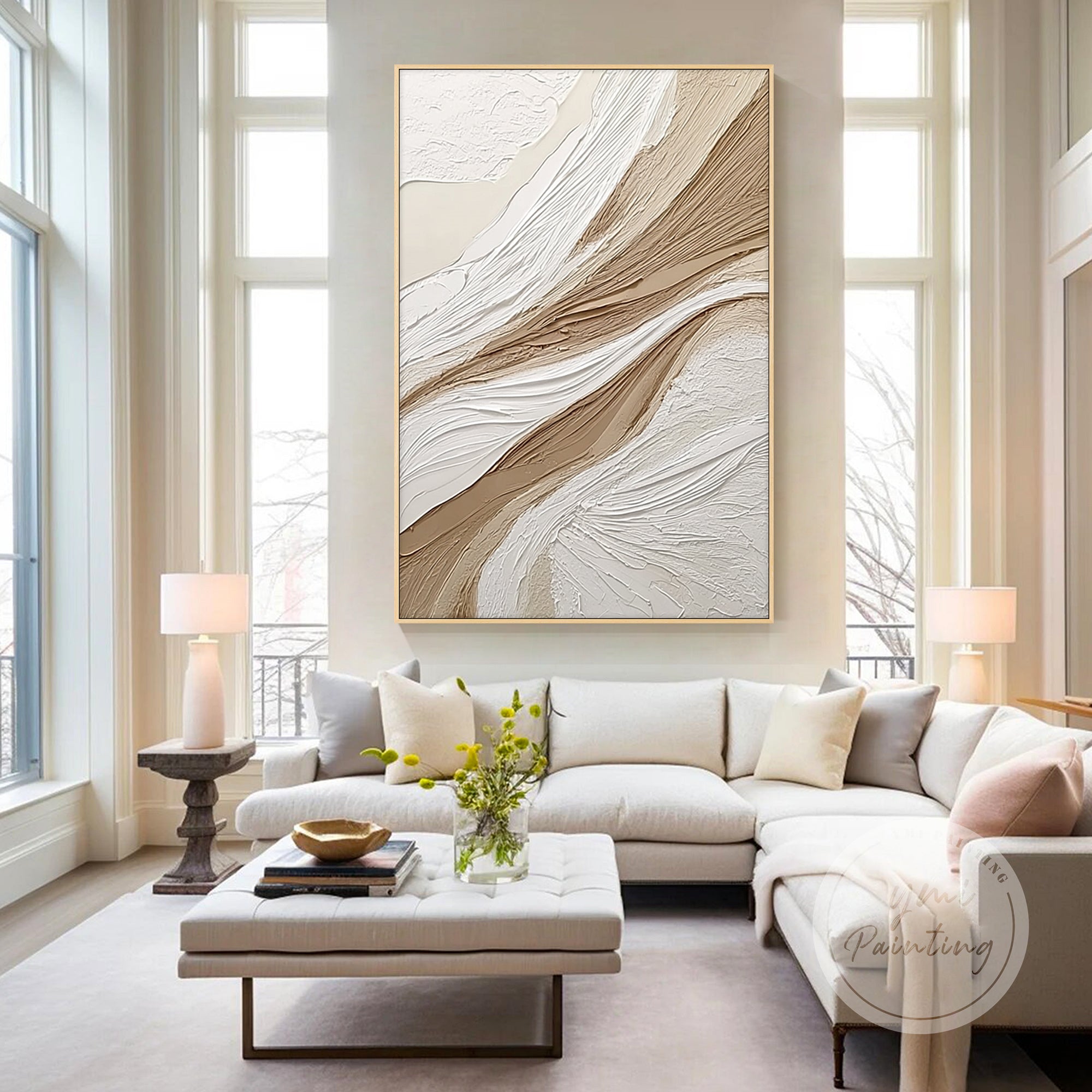 beige white canvas painting above sofa in living room