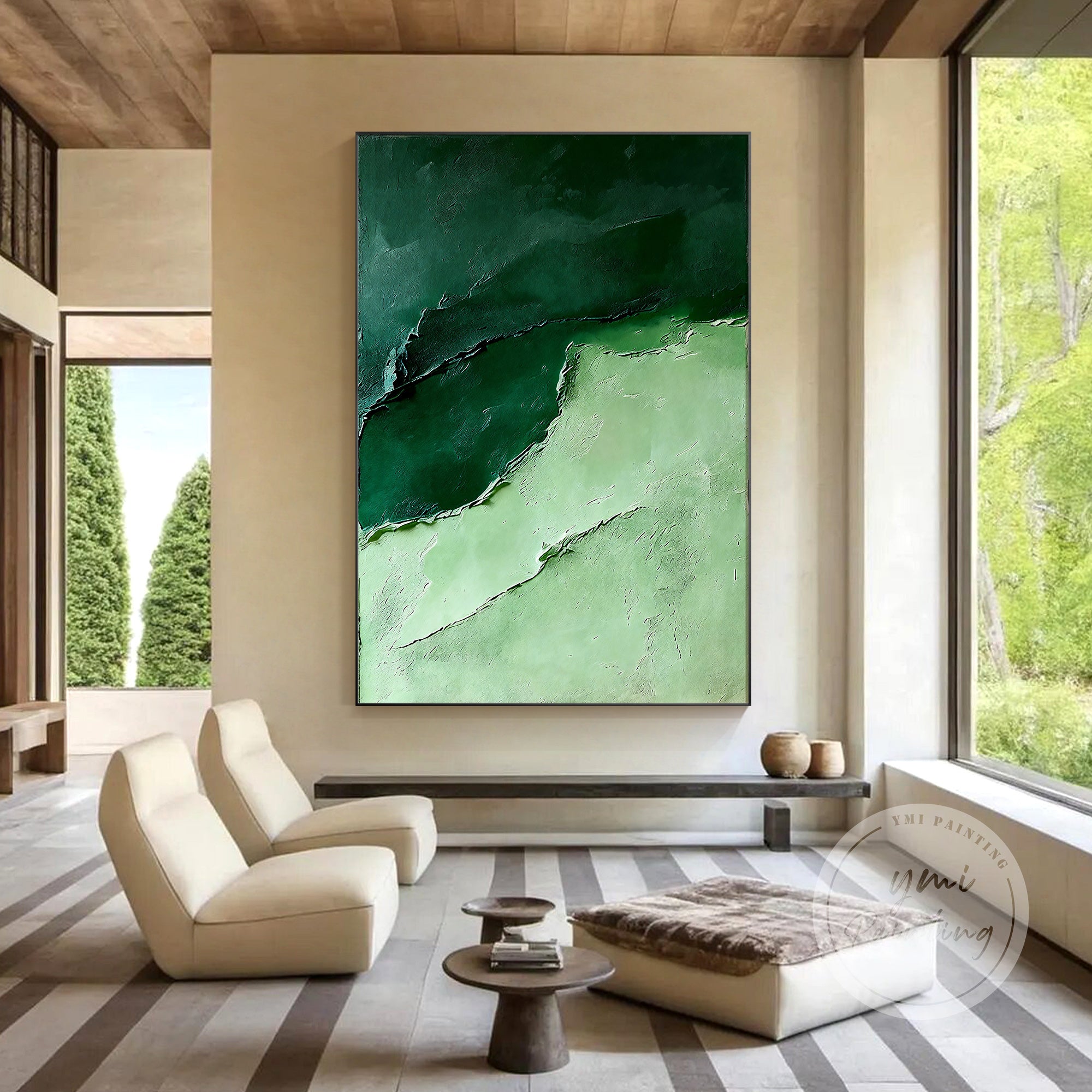 Deep green relief canvas artwork displayed in a bright living room.