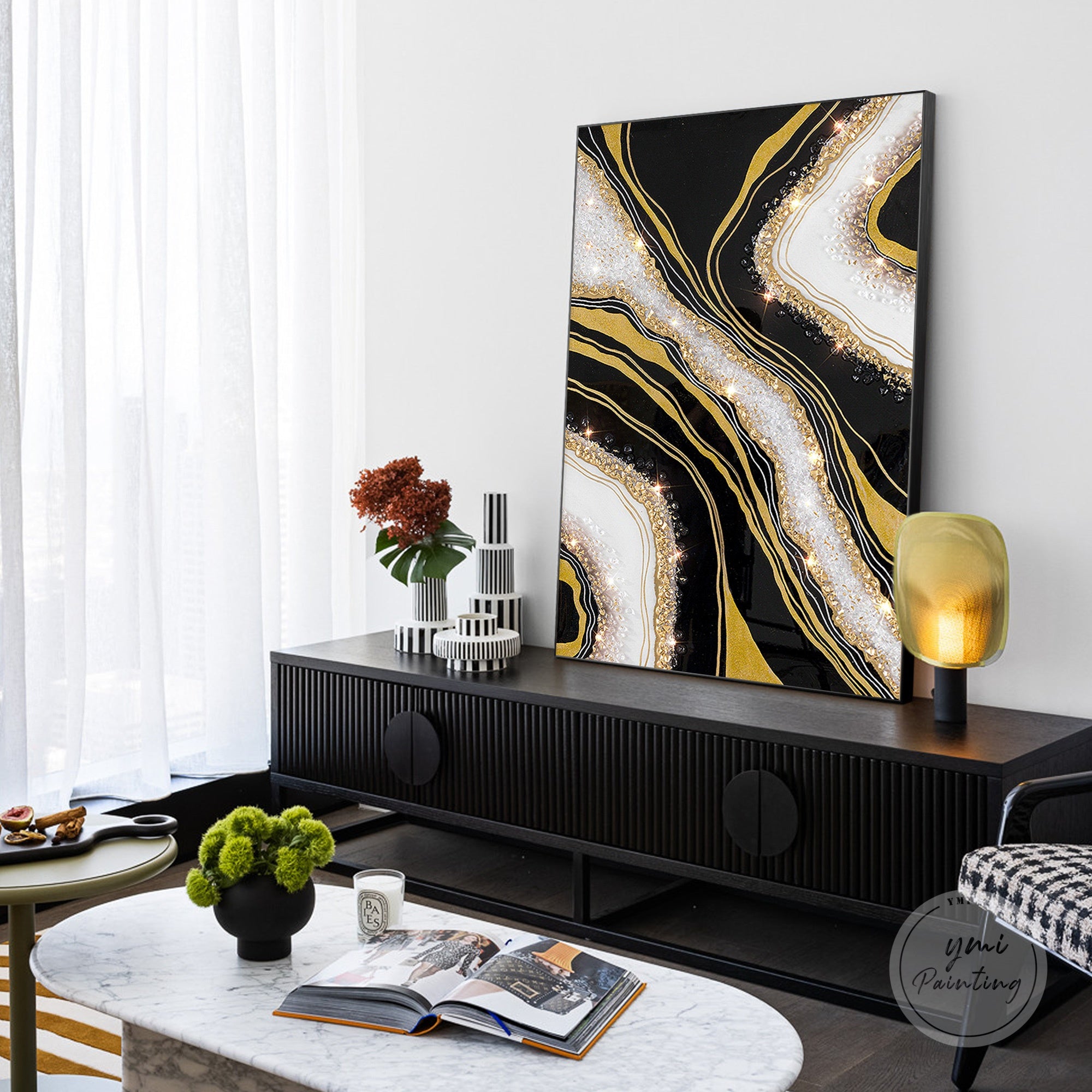 Oversized resin wall art featuring black and gold geode textures and crystals.