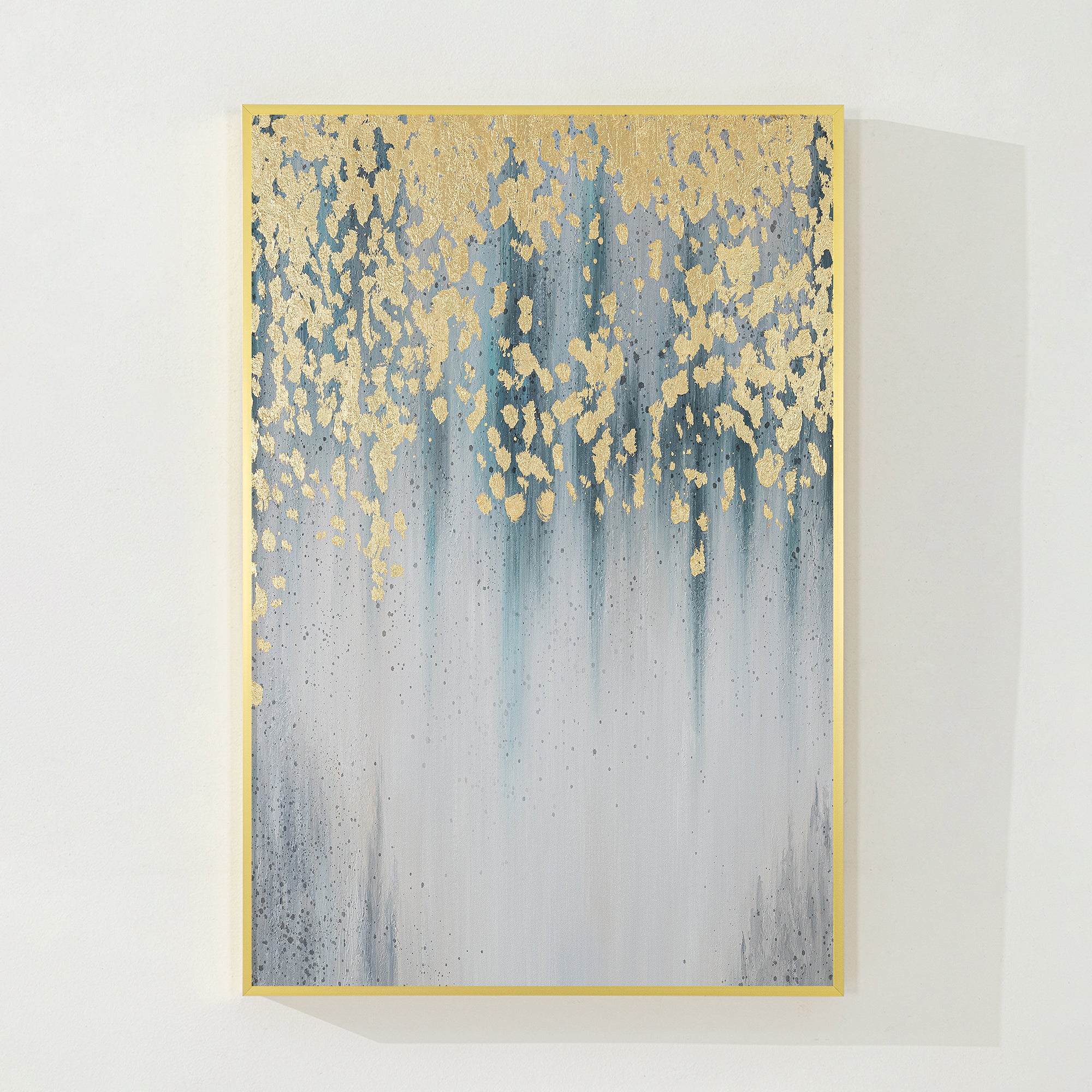 Modern abstract art with gold leaf and water droplets against a gradient of blue and gray.