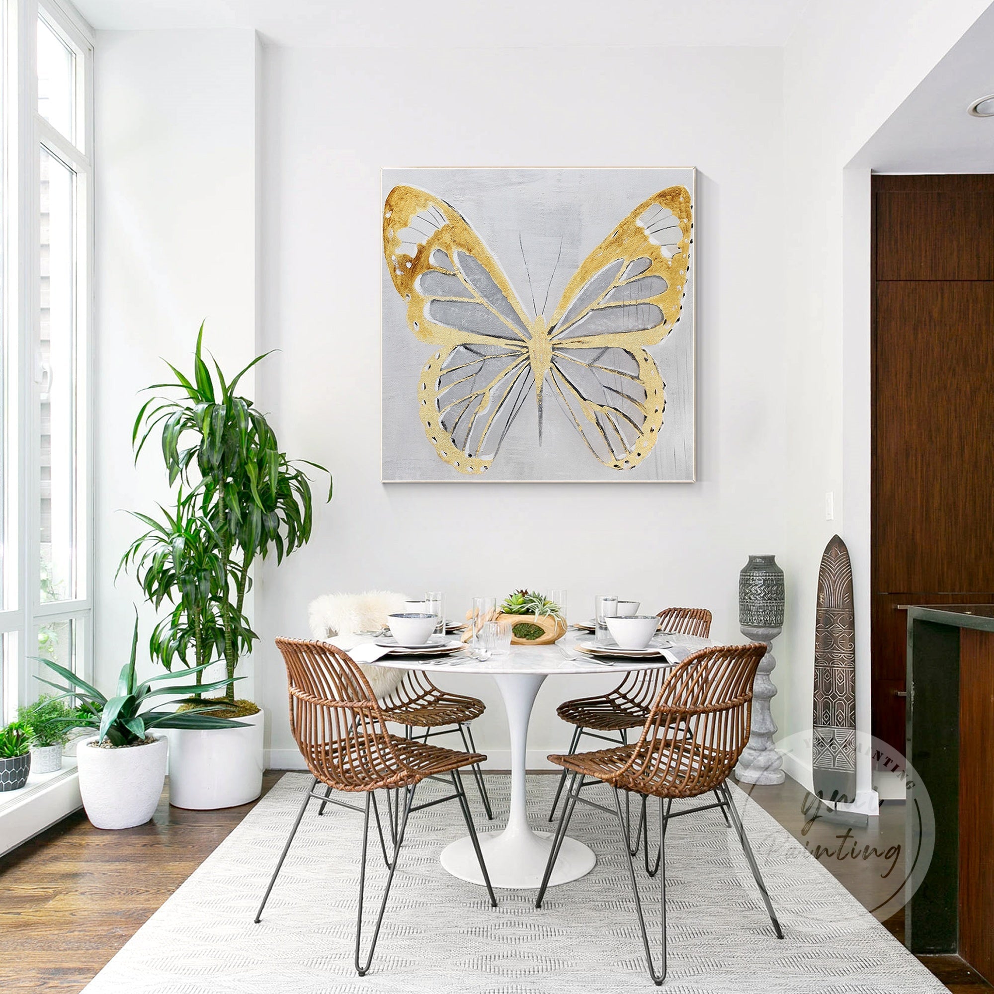 Large framed butterfly artwork with bold gold leaf accents and subtle abstract elements, designed to create a striking focal point.