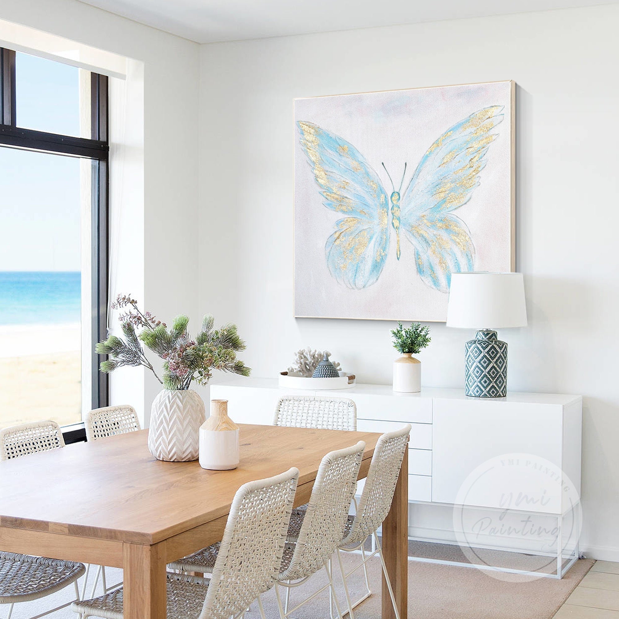 Modern Abstract Butterfly Painting in soft blue hues with gold embellishments, a timeless piece for any space.