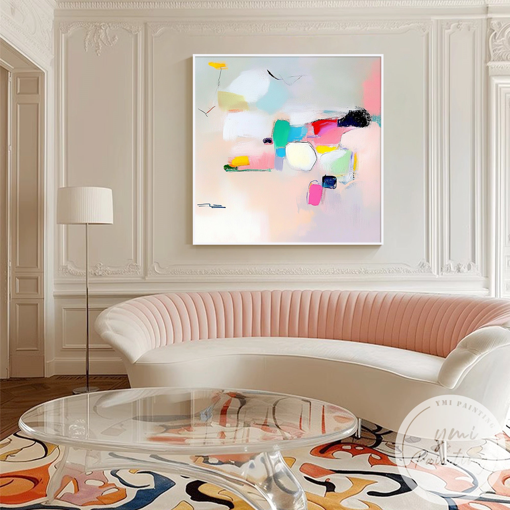 Modern abstract canvas painting above white sectional sofa
