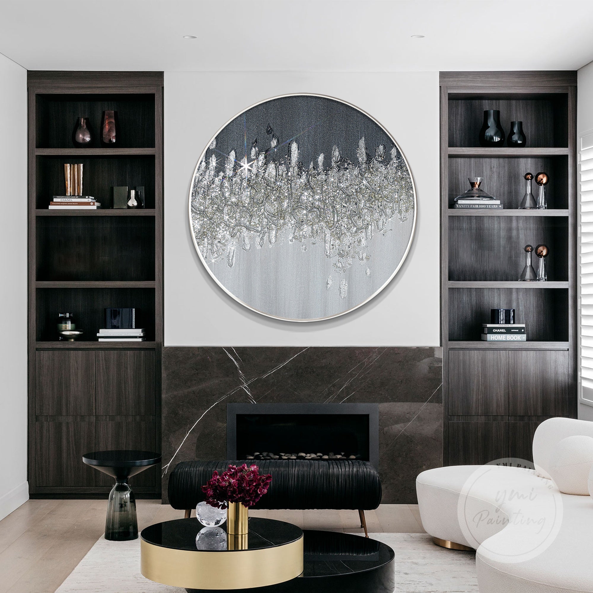 Black and silver crushed glass art in a circular form, capturing light for a dazzling effect.