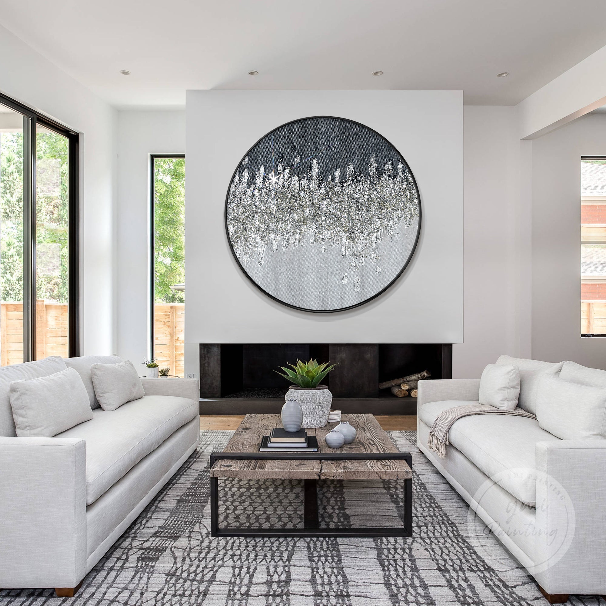 Abstract round glitter painting with rich textures and a monochrome palette of black and silver.