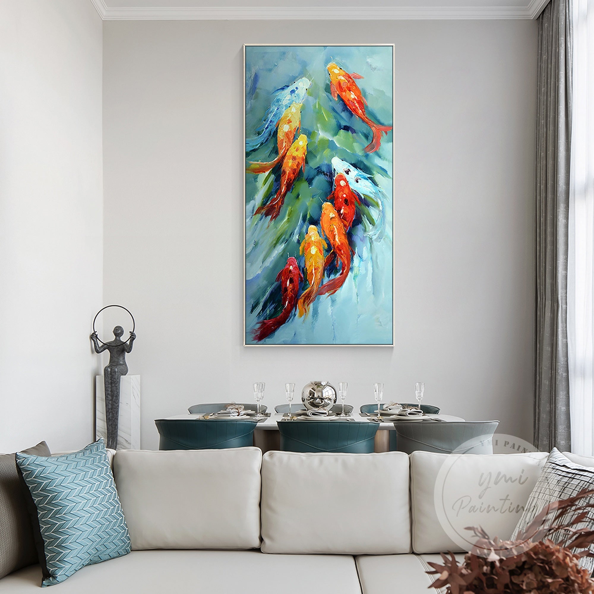 Horizontal wall art showing three koi fish in motion, their orange and yellow scales contrasting with soft blue water ripples.
