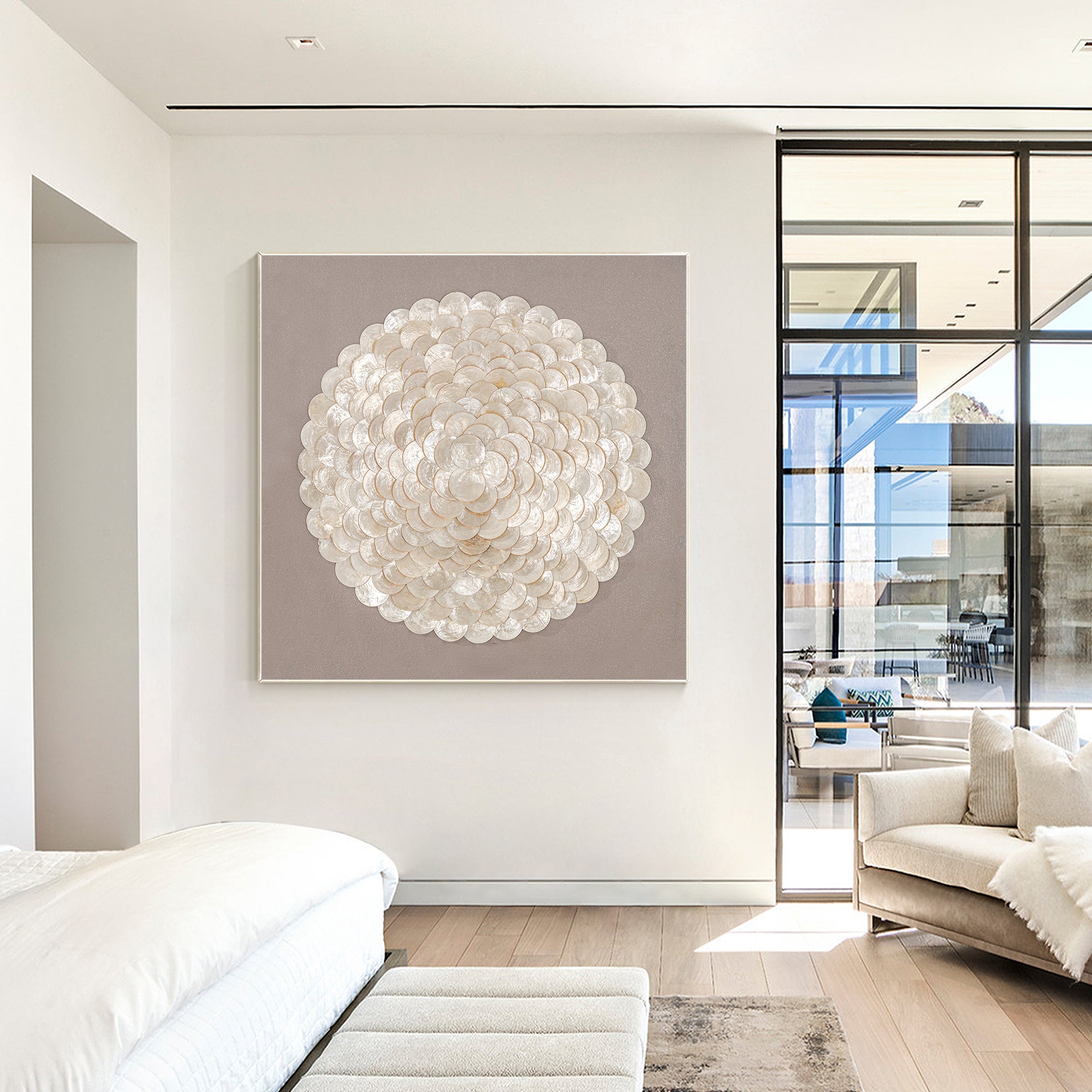 Large canvas wall art with organic circular white seashell pattern in a modern living room.