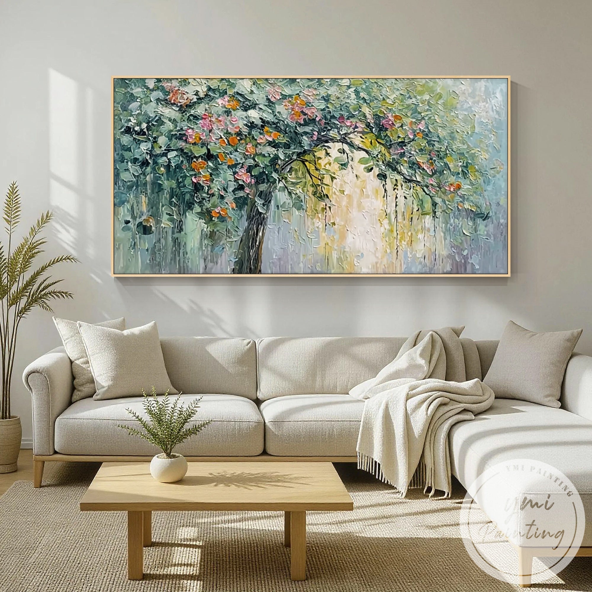 Textured tree artwork hanging above wooden dining table in bright dining room
