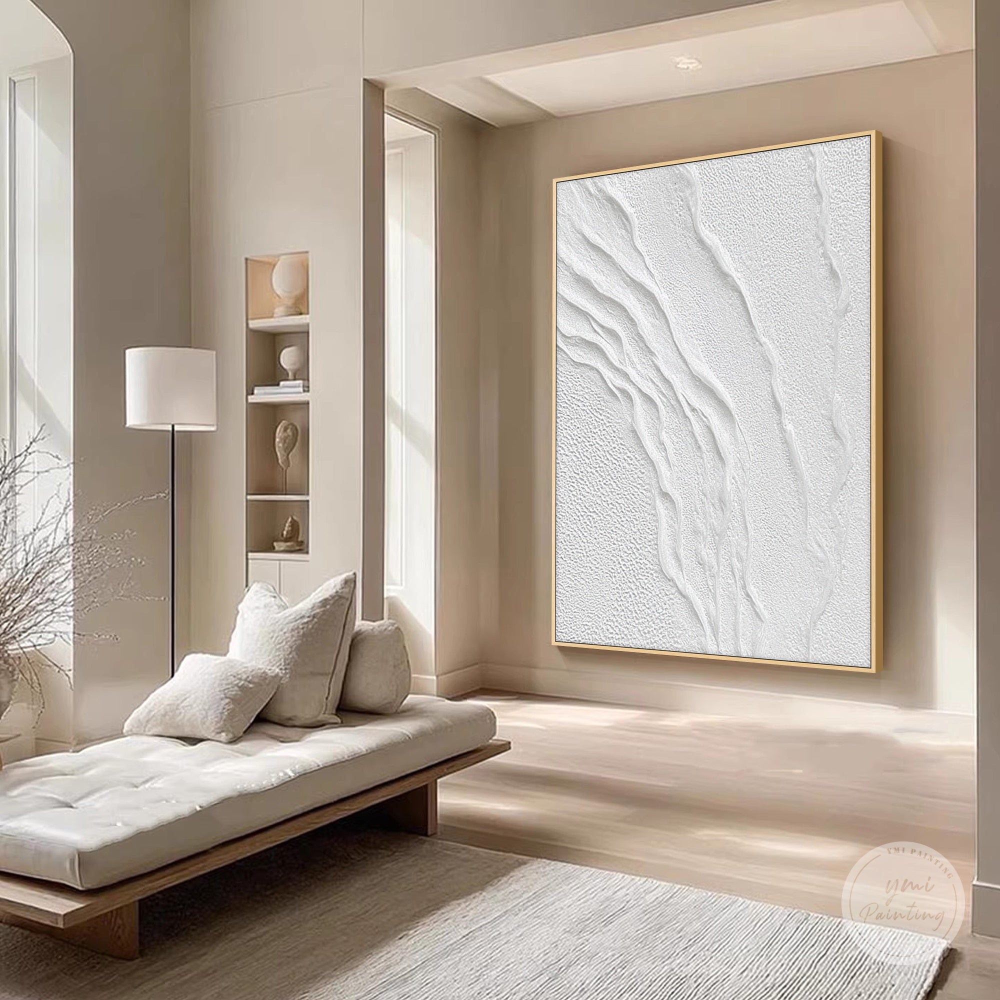 Minimalist white wall art displayed above a console table in a calm modern hallway
