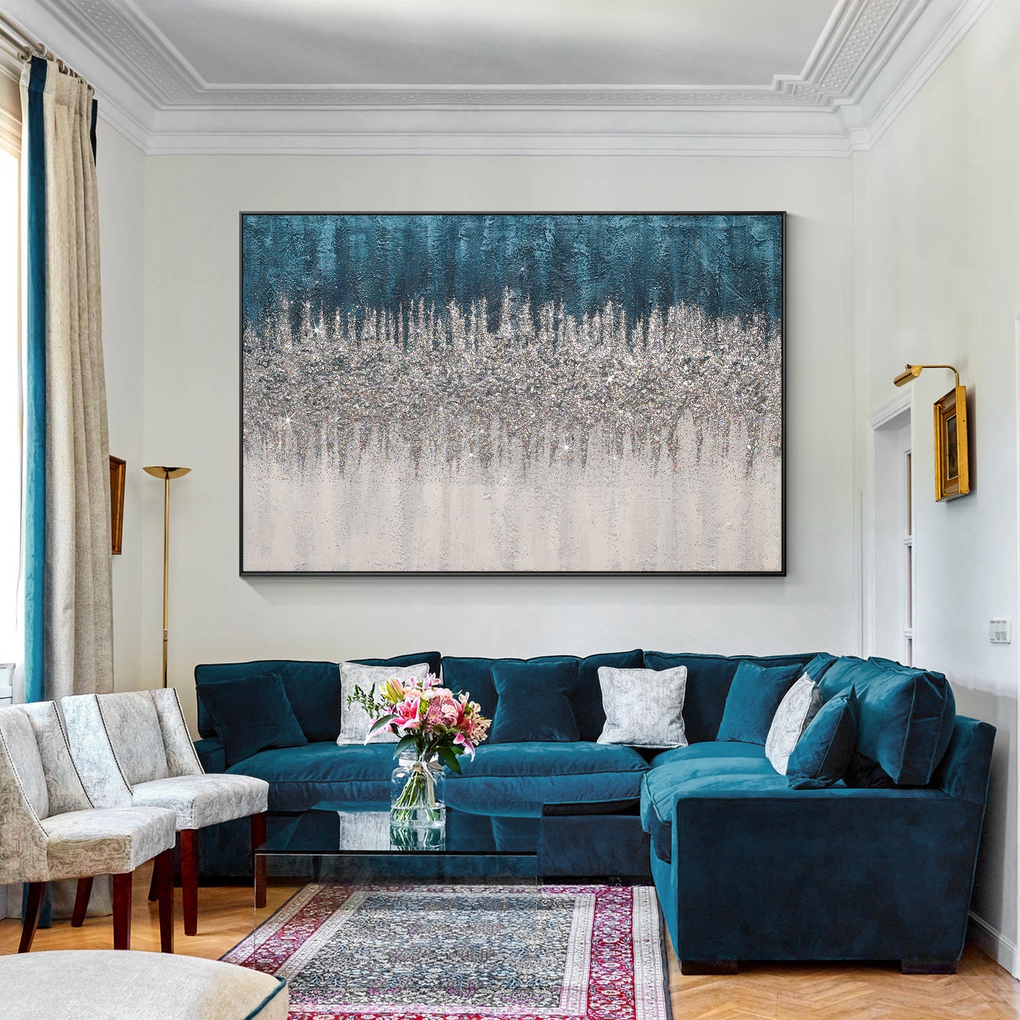 Textured turquoise glitter wall art paired with a sofa in similar color tones in a living room
