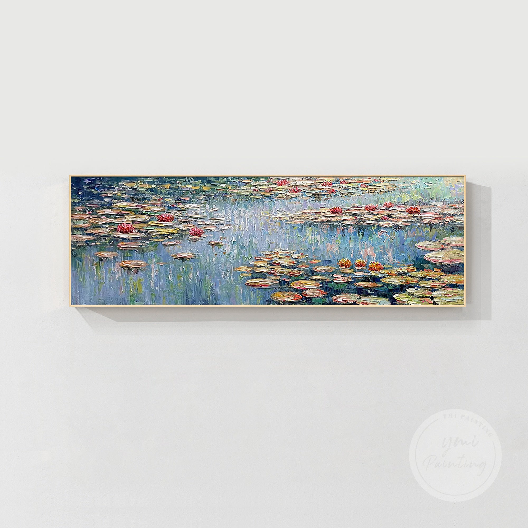 Large framed Monet wall art featuring the soft, tranquil tones of a water lily pond.