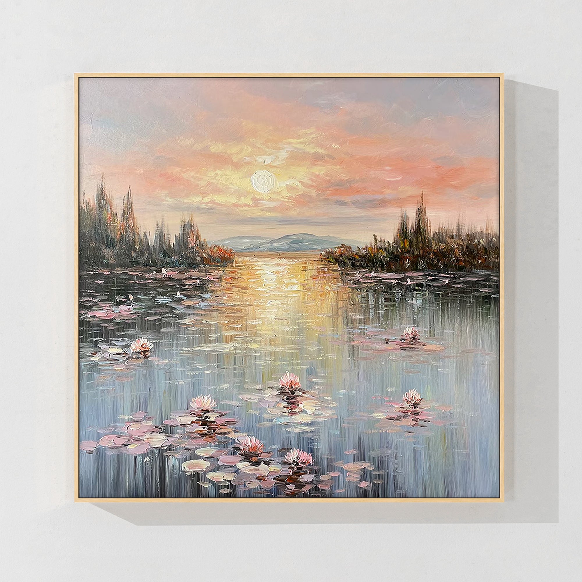 Beautiful Monet painting of water lilies in soft pink and orange tones, creating a peaceful atmosphere for any room.