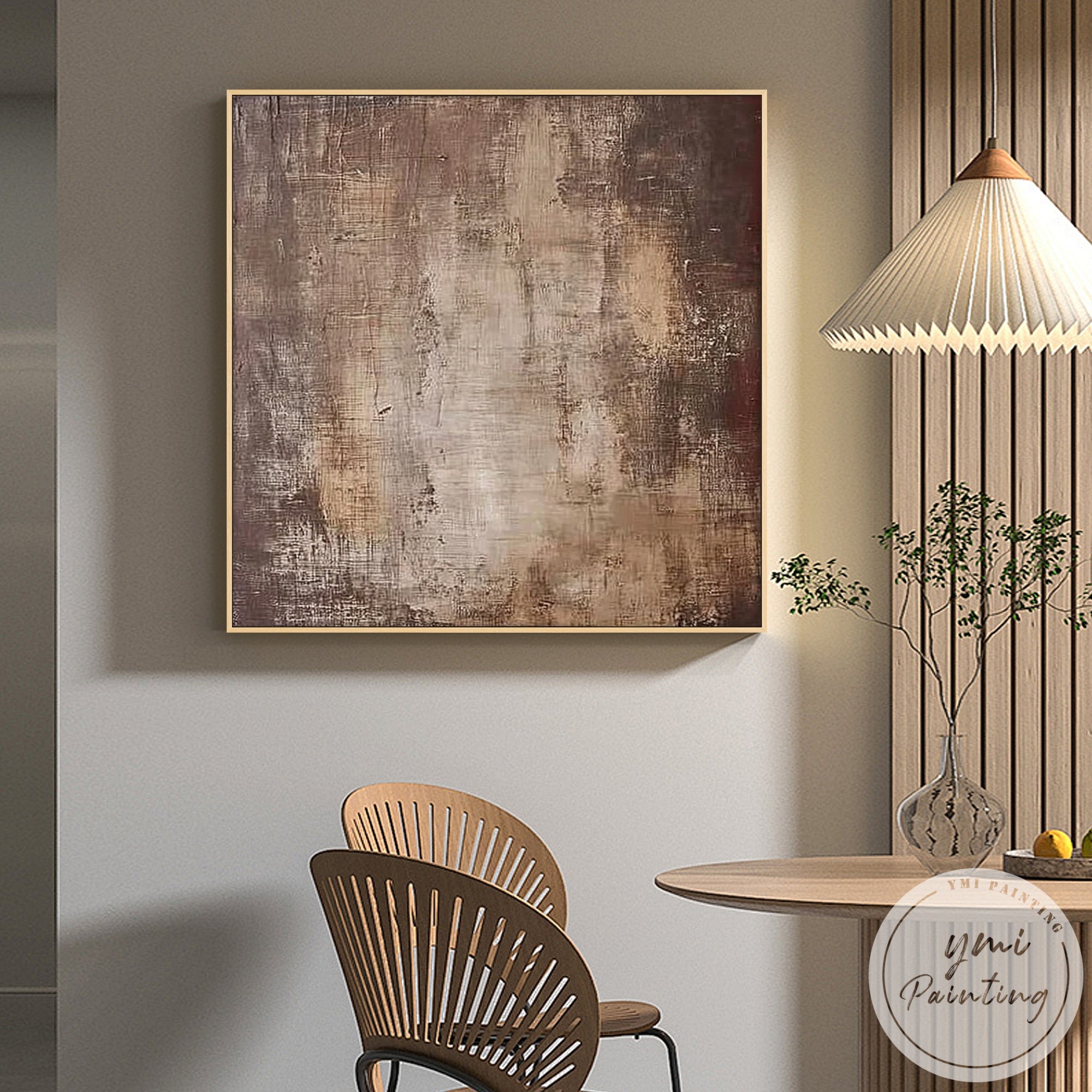 Neutral earth tone wall art in bright airy living room with soft natural lighting
