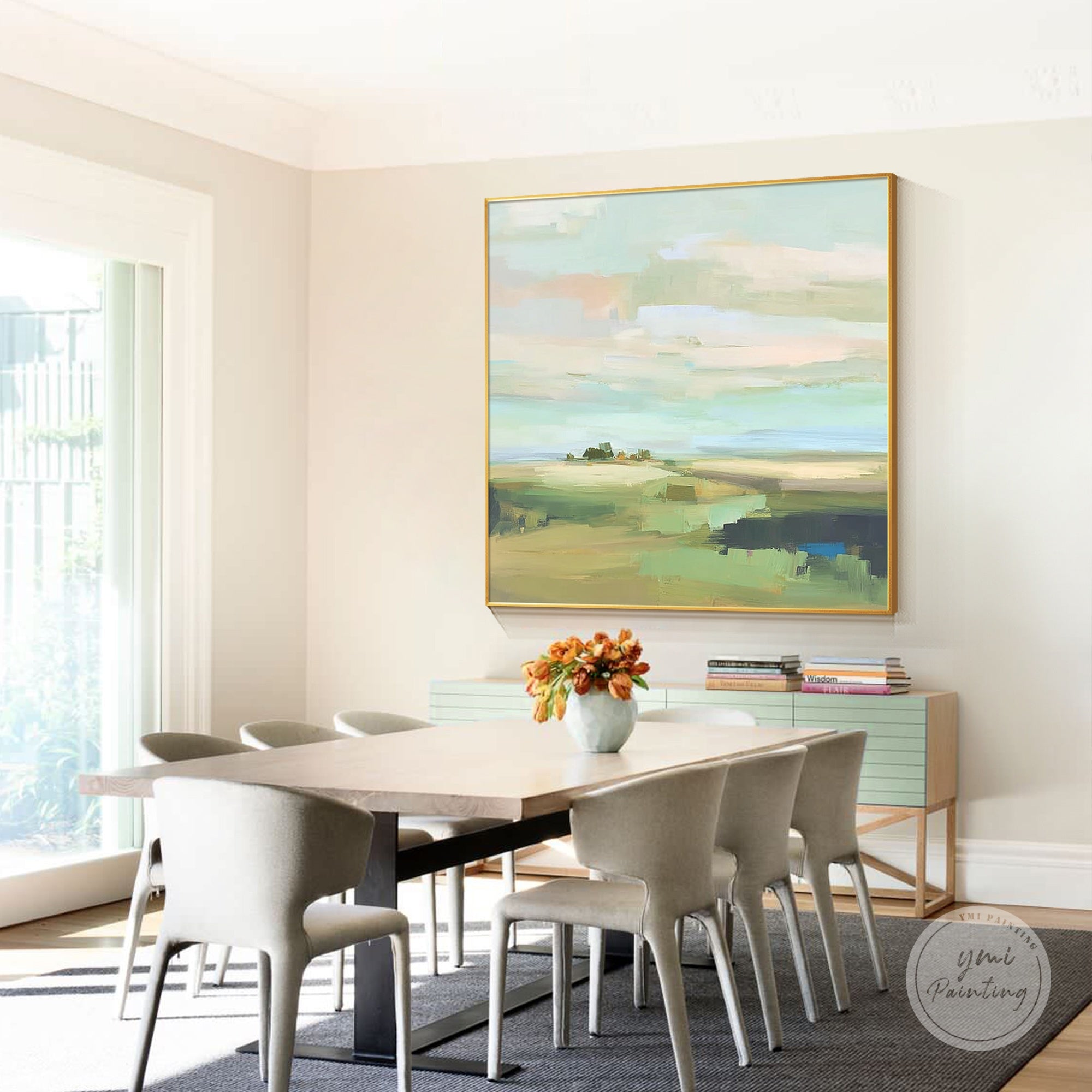 Soft pastel abstract landscape painting displayed in a modern dining room