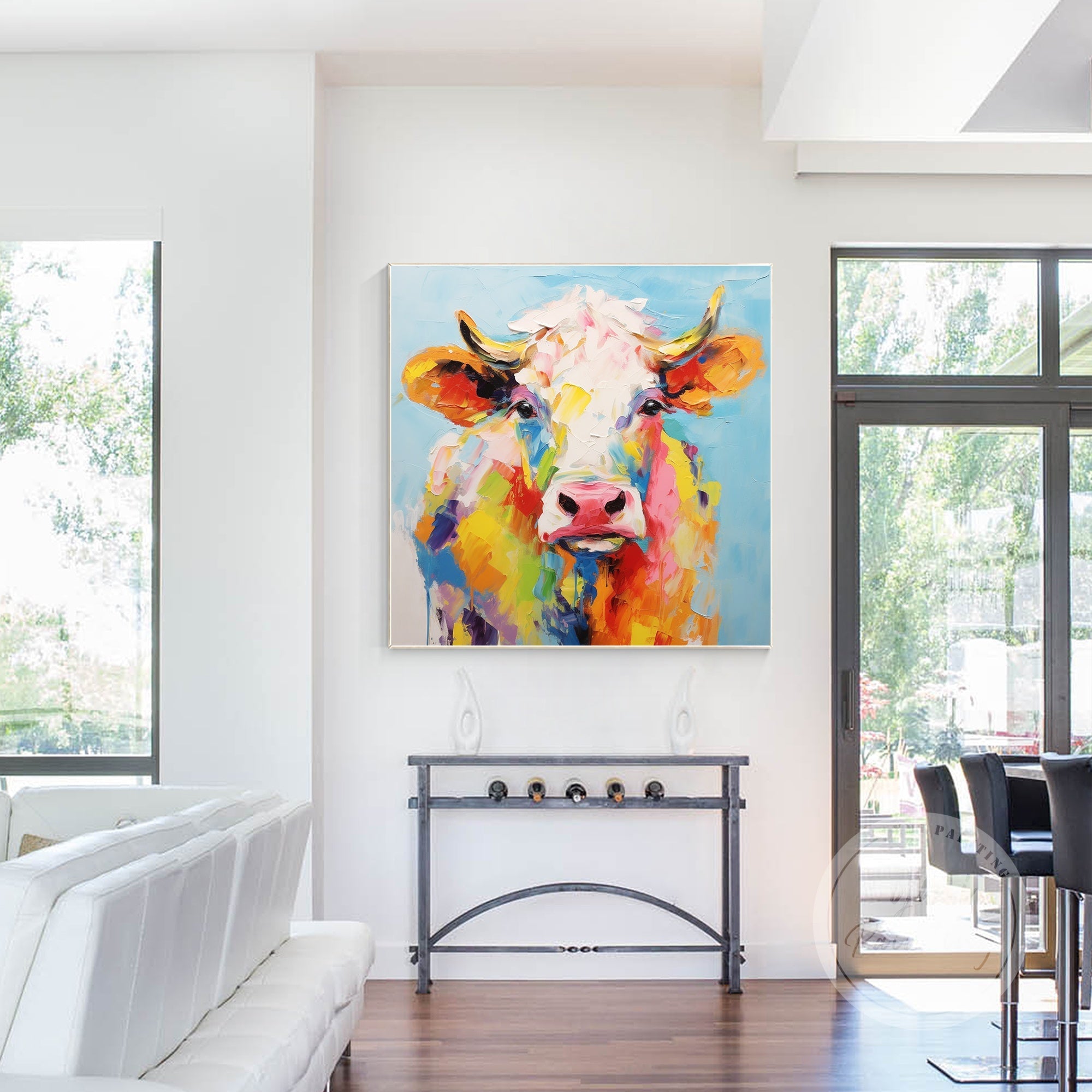 Inject a pop of color into your living room with this playful hand-drawn cow portrait, perfect for creating a fun and inviting atmosphere.