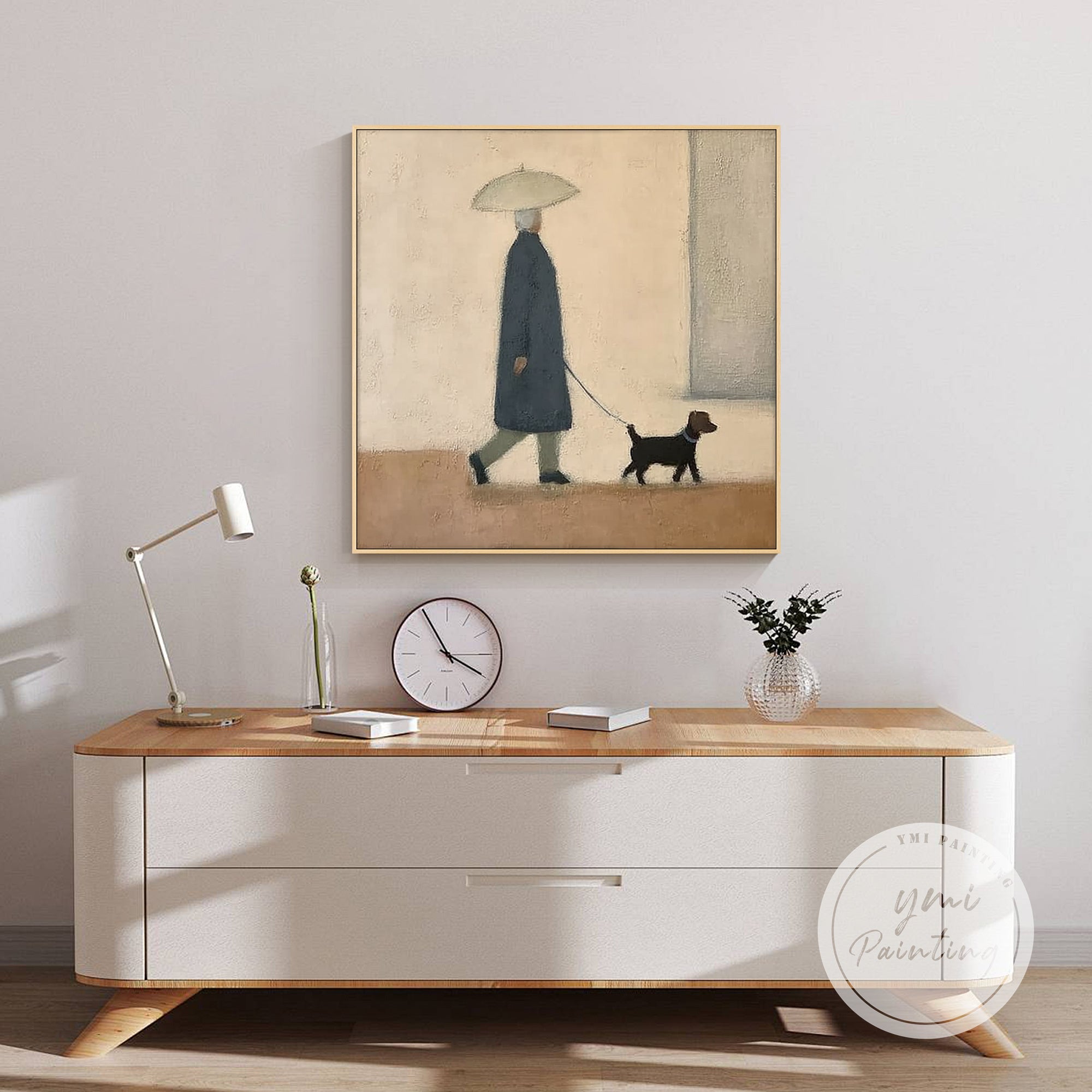 Serene wall art of walking person and dog, displayed in a bedroom setting.