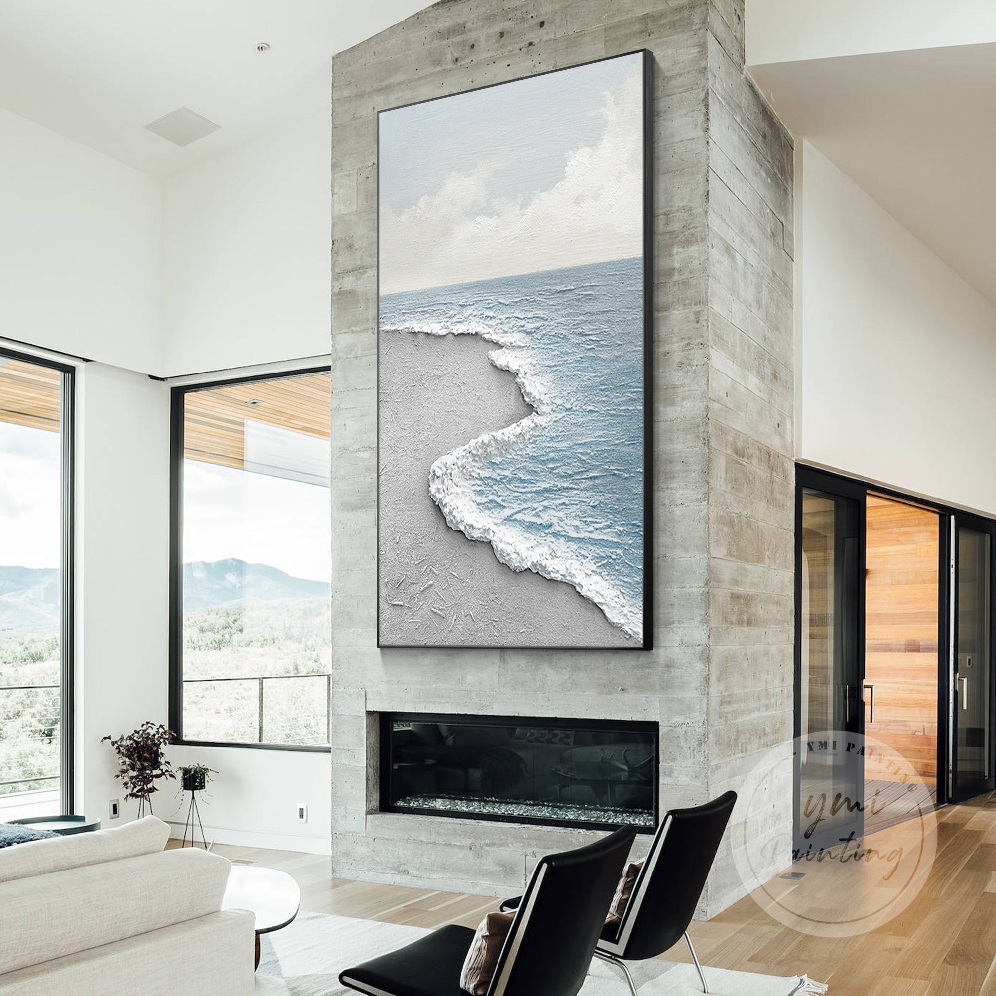 Large framed wall art of a textured sea wave in calming blue, white, and gray tones.