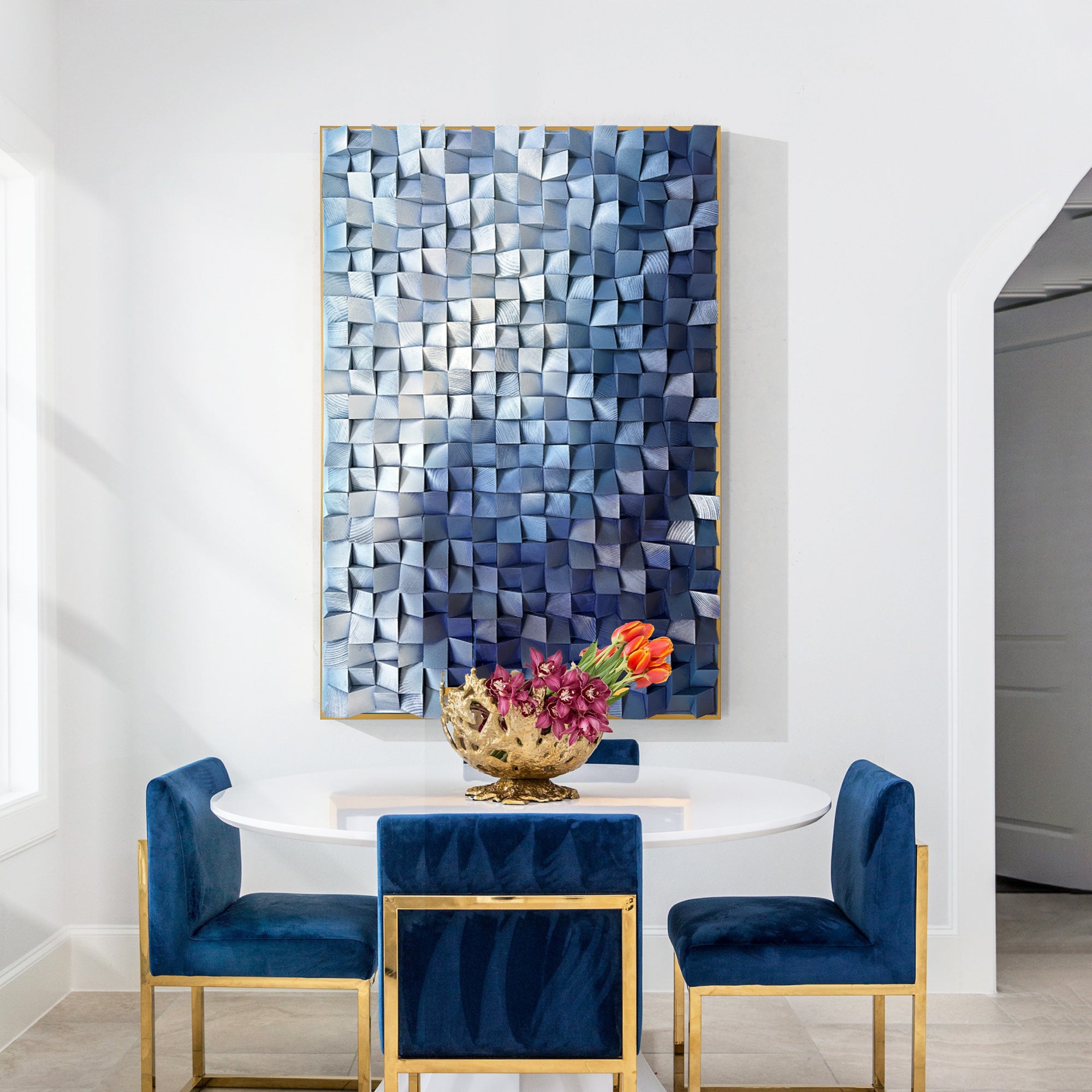 Vertical wall art showcasing three-dimensional blocks covered in gradient blue wood, transitioning from light to dark blue in dining room.