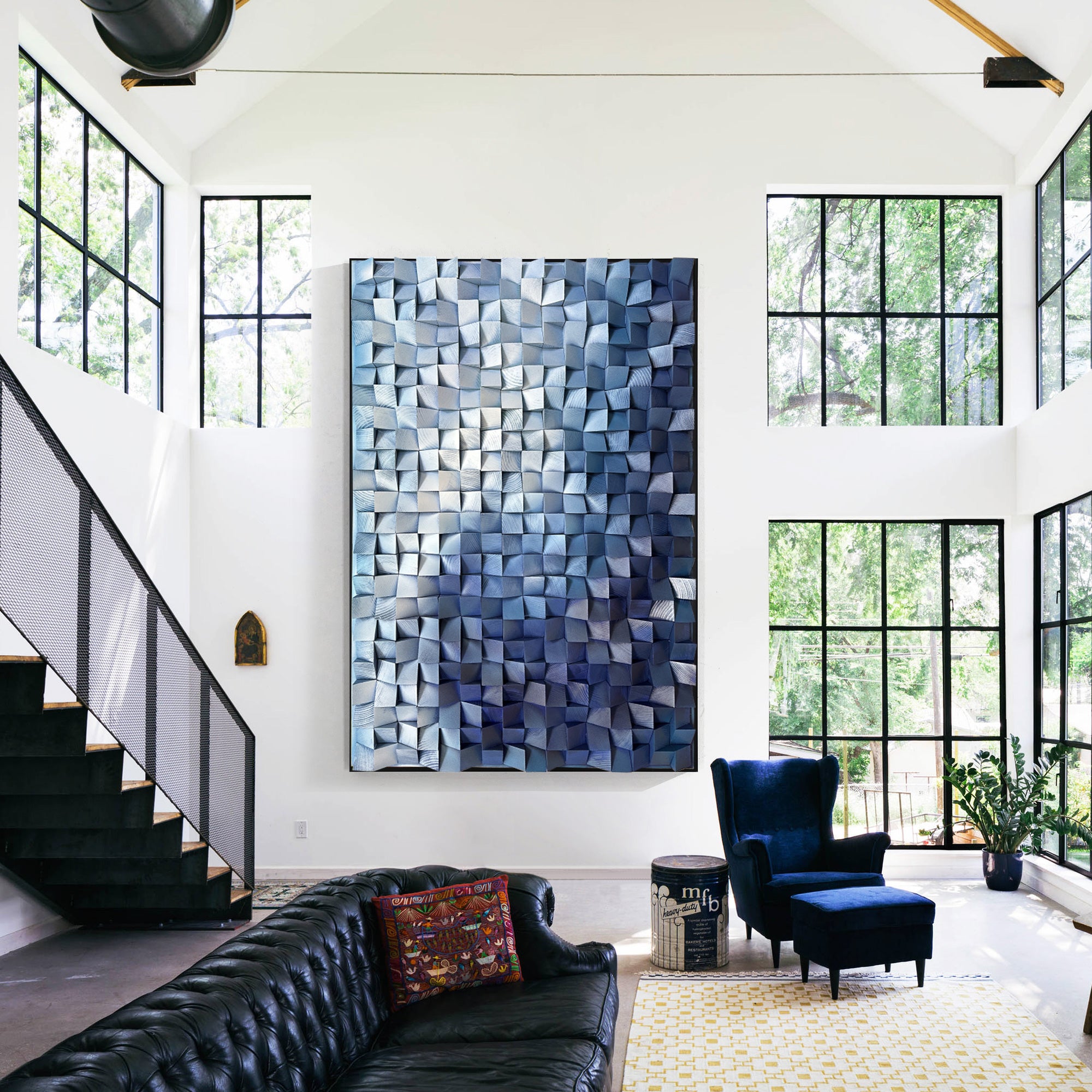 Vertical wall art showcasing three-dimensional covered in gradient blue wood cube, transitioning from light to dark blue.