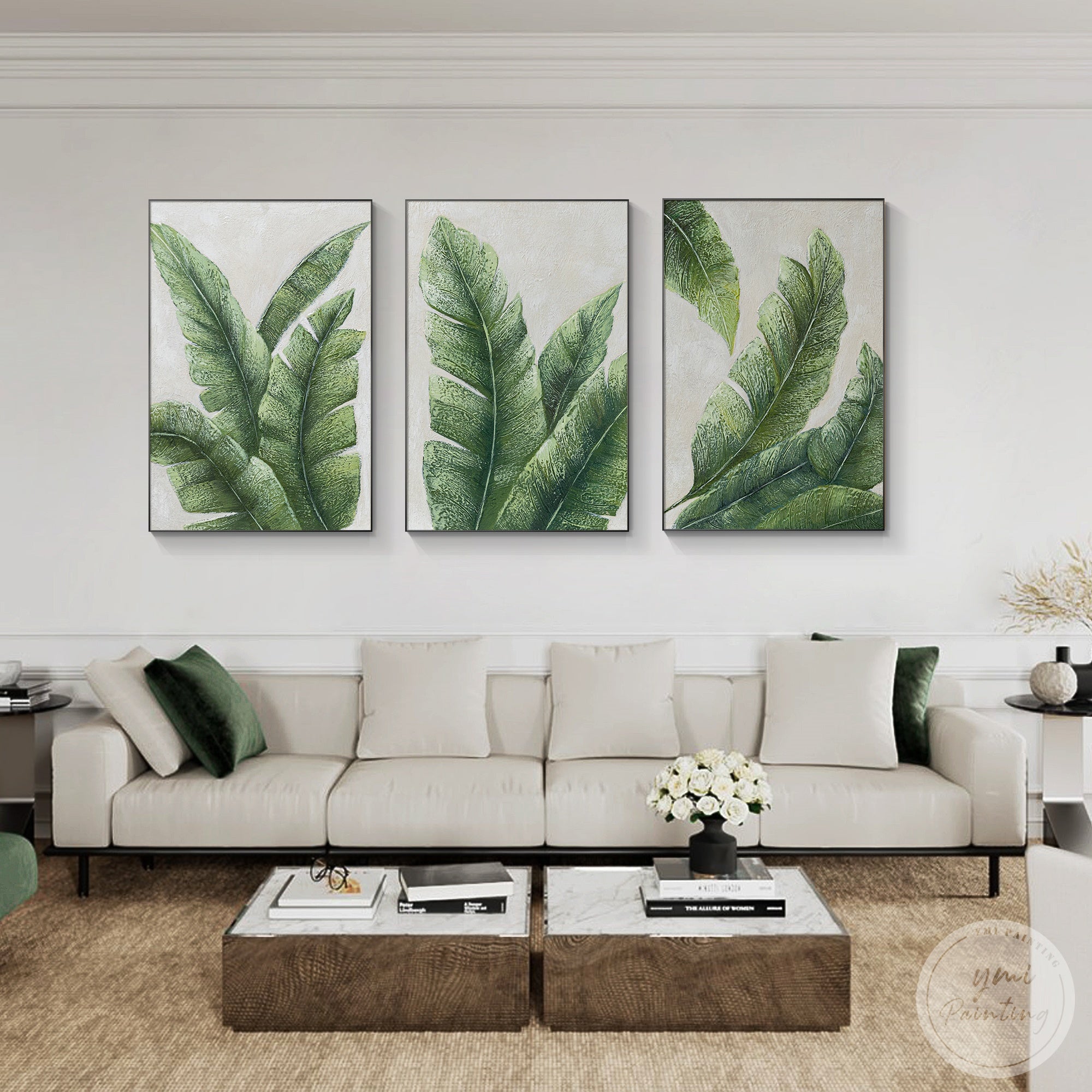 Tropical leaf print set of three displayed above a living room sofa