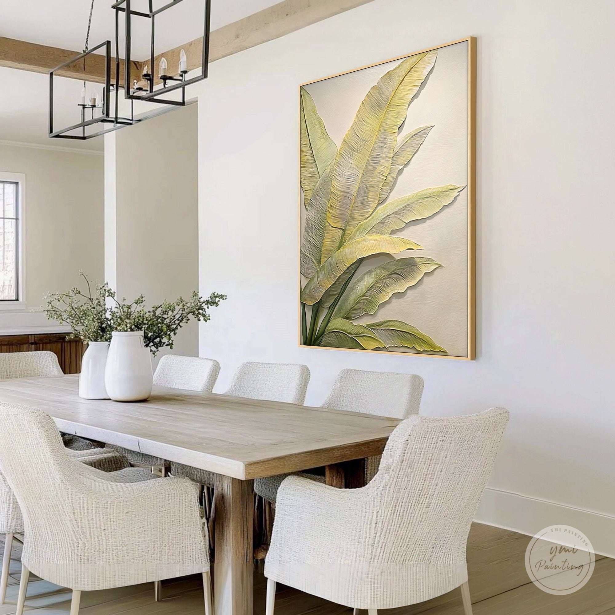 Green tropical leaf wall art featured in a home dining room