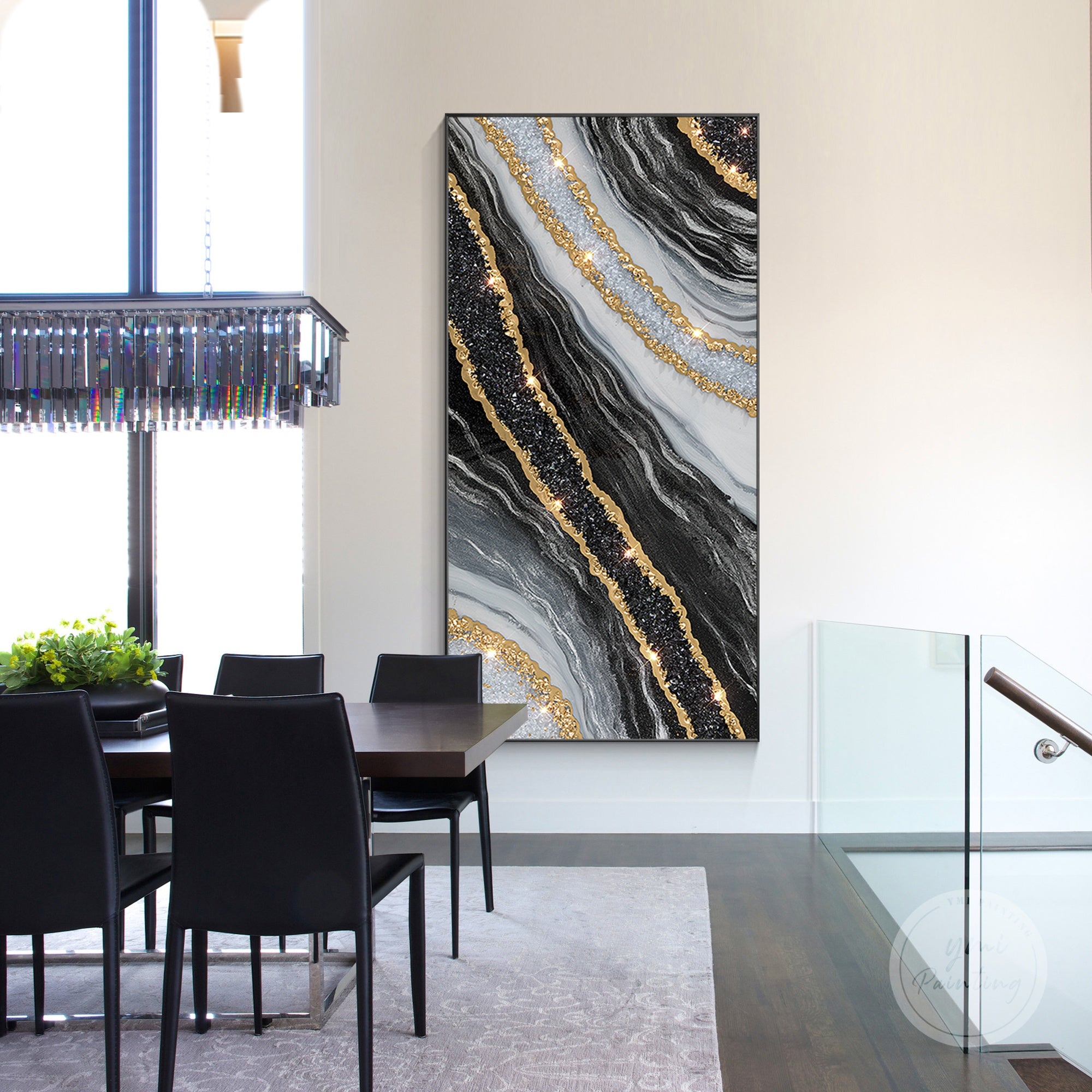 Oversized resin geode painting with black and gold tones and crystal accents.