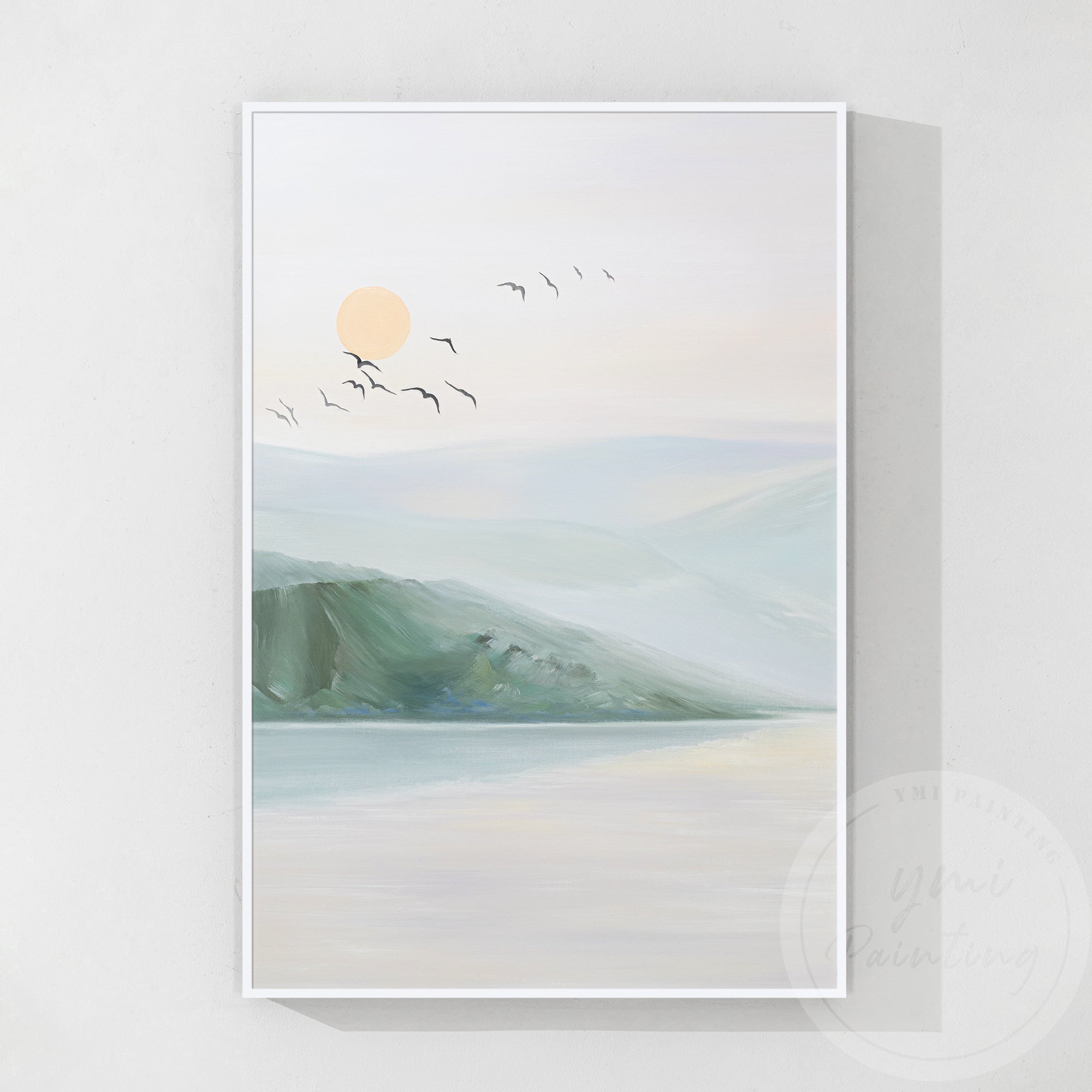 Calm sunset with reflections of mountains and bird silhouettes against a peach-pink sky.