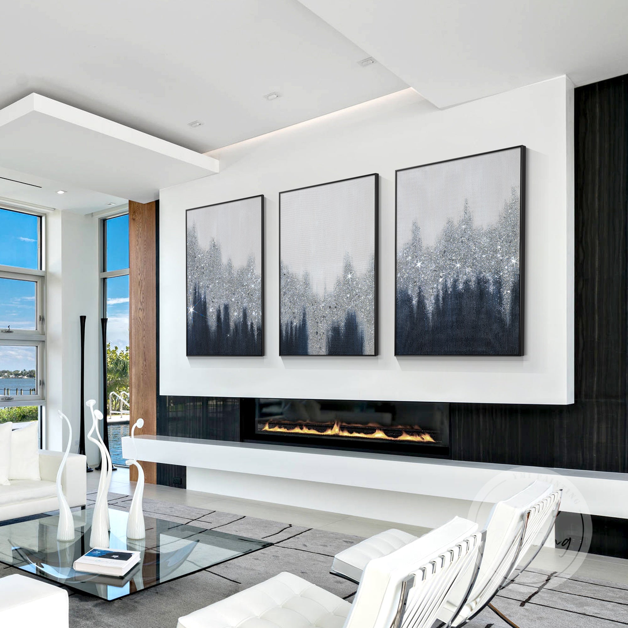 Hand-painted abstract navy blue, gray, and silver textured wall art in a modern living room over a fireplace