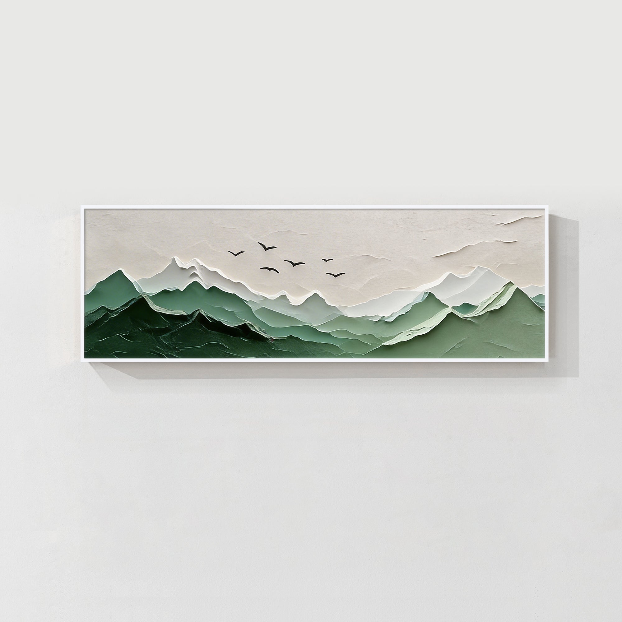 layered green mountain wall art above modern living room sofa